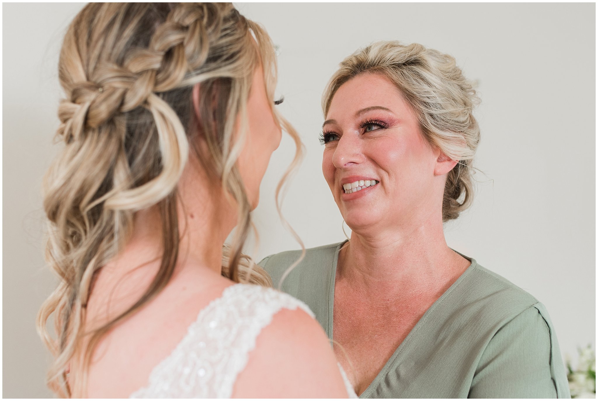 Mom helping bride get in wedding dress | Sage Green and Gray Summer Wedding at Oak Hills | Jessie and Dallin Photography