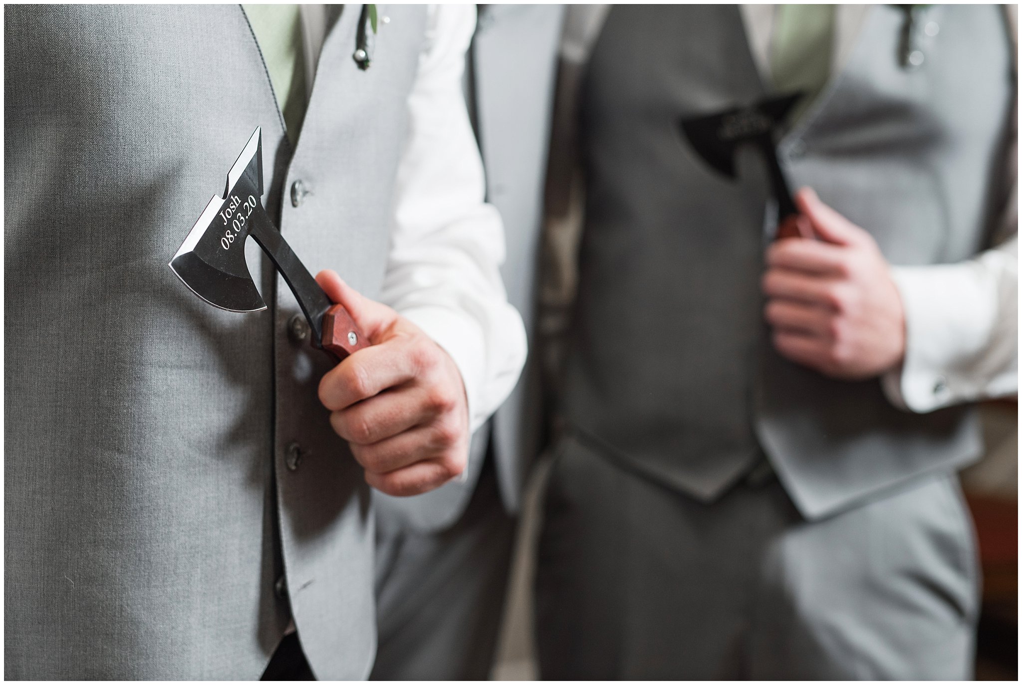 Groom with groomsmen getting ready in gray suits and sage green ties and giving groomsmen axes | Sage Green and Gray Summer Wedding at Oak Hills | Jessie and Dallin Photography