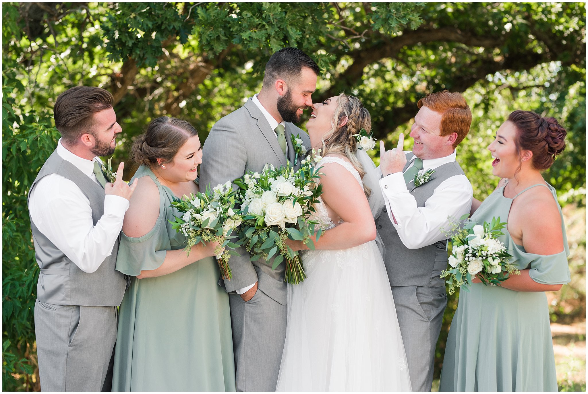 Wedding party in woods wearing gray suit and vests and sage green tie and champagne dress with sage green bridesmaid dresses | Sage Green and Gray Summer Wedding at Oak Hills | Jessie and Dallin Photography