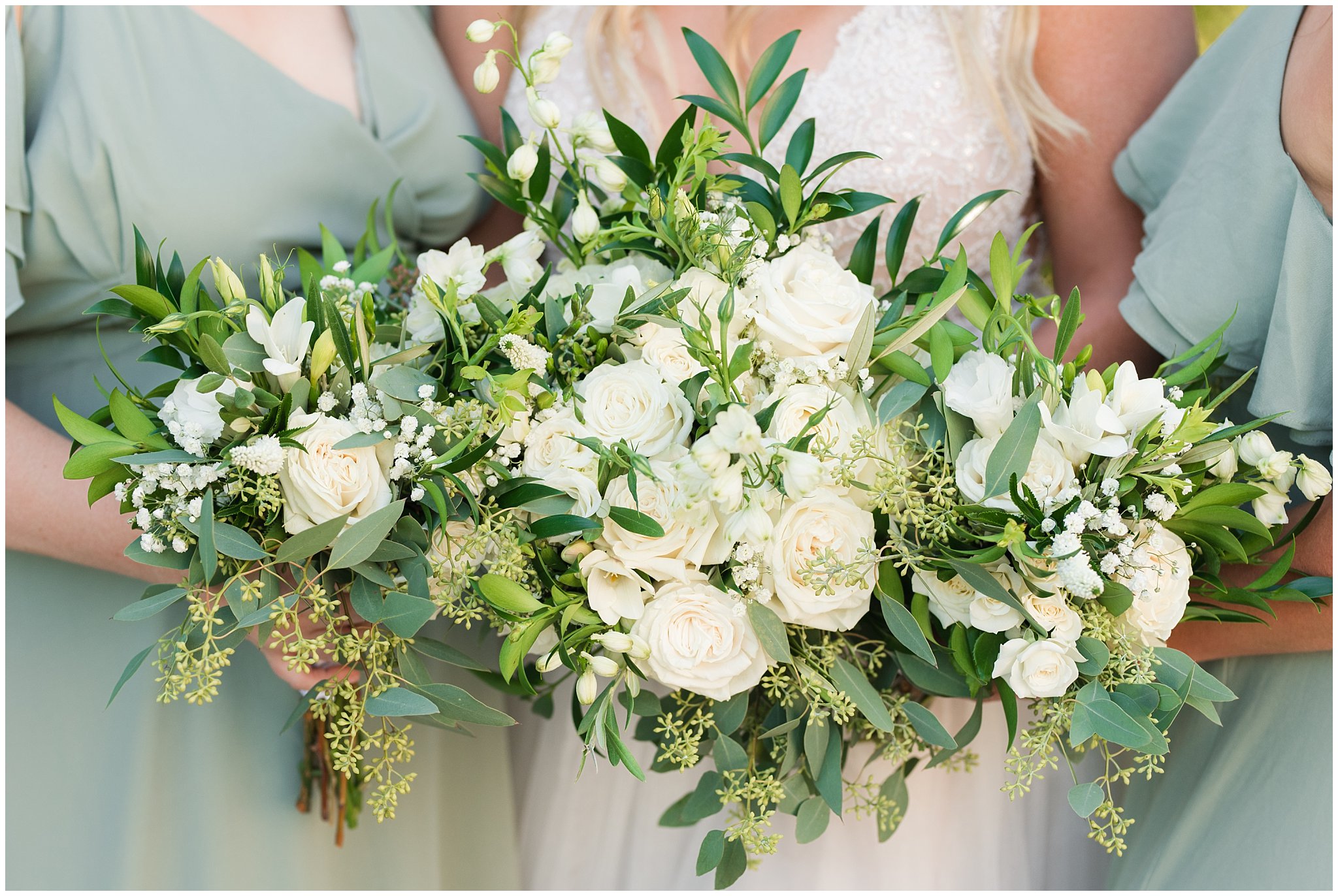 White floral bouquets held by bridesmaids and bride wearing champagne dress with sage green bridesmaid dresses | Sage Green and Gray Summer Wedding at Oak Hills | Jessie and Dallin Photography
