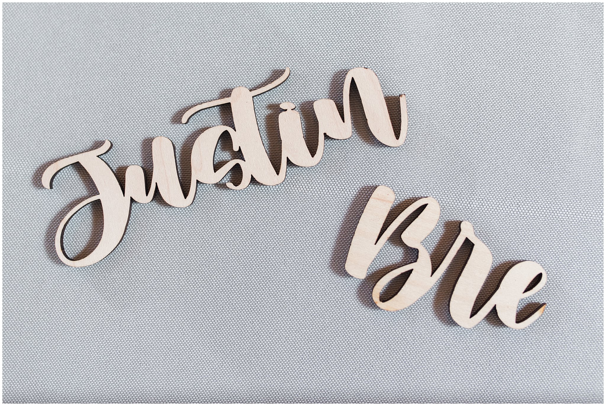 Laser cut names of the bride and groom for seating chart | Sage Green and Gray Summer Wedding at Oak Hills | Jessie and Dallin Photography