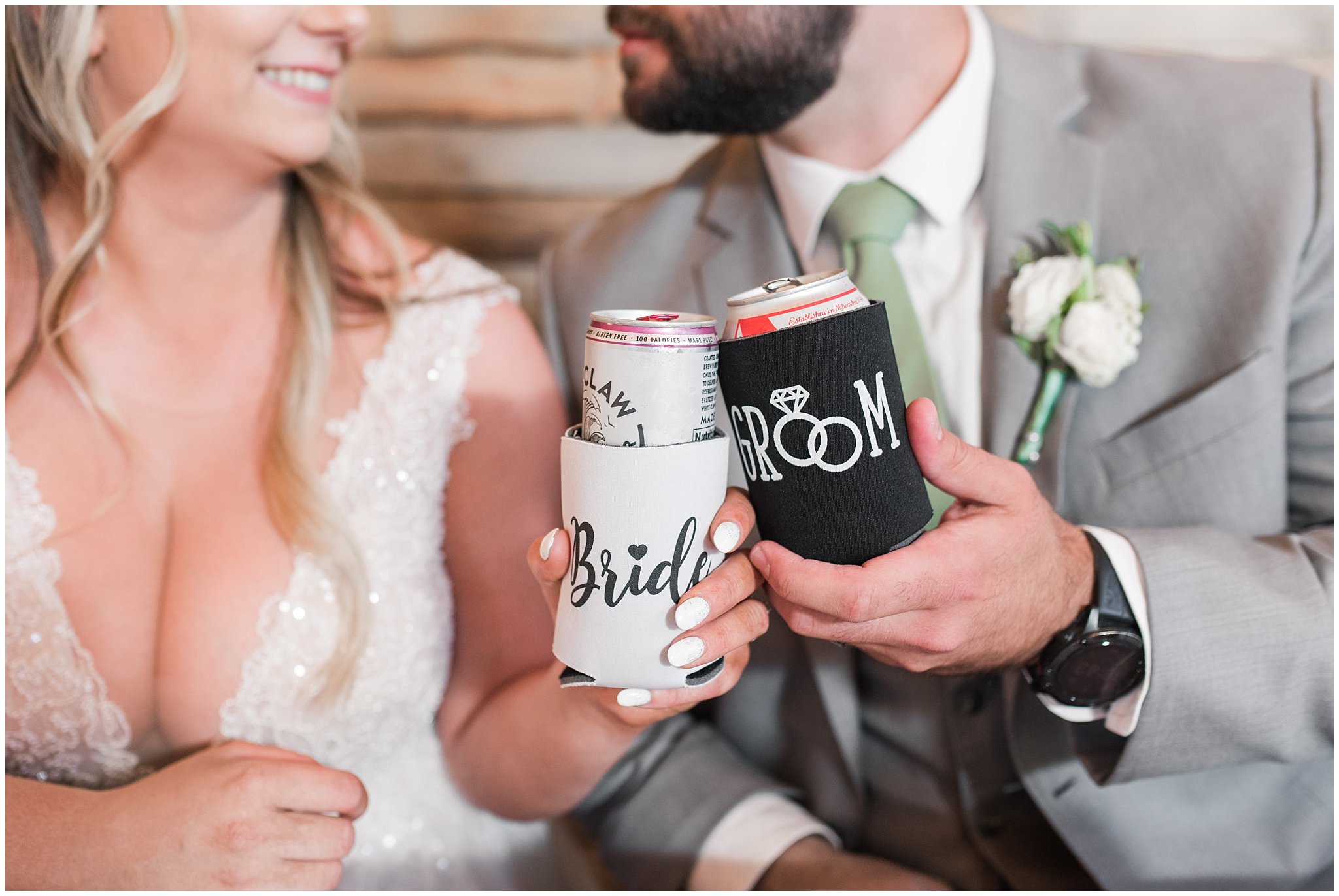 Bride and groom holding custom drink koozie | Sage Green and Gray Summer Wedding at Oak Hills | Jessie and Dallin Photography