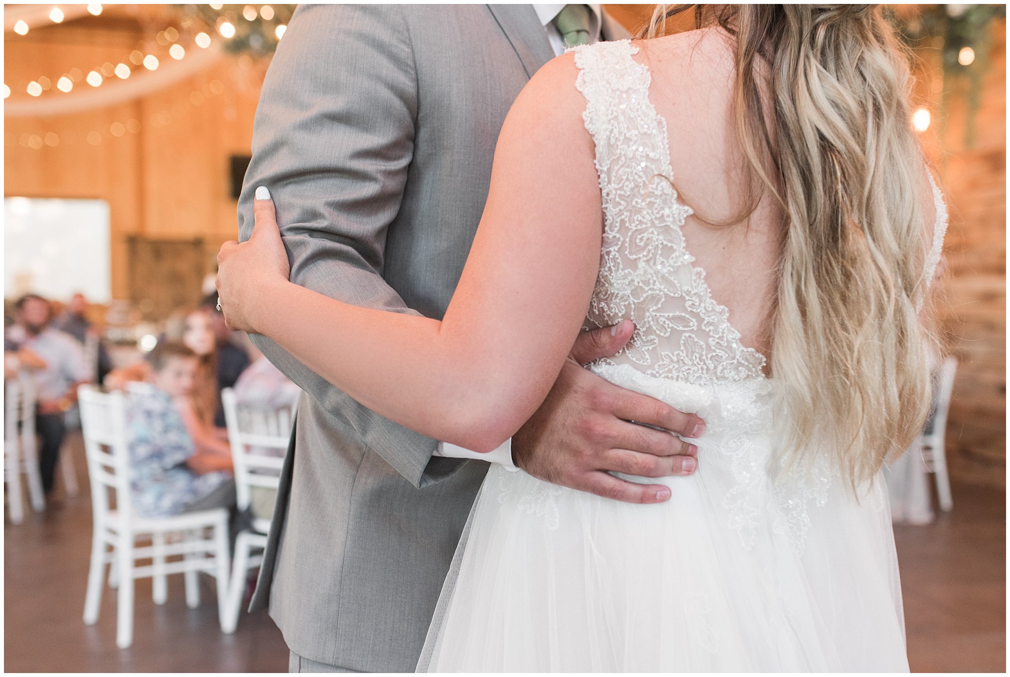 Bride and groom first dance during Oak Hills wedding in the barn | Sage Green and Gray Summer Wedding at Oak Hills | Jessie and Dallin Photography
