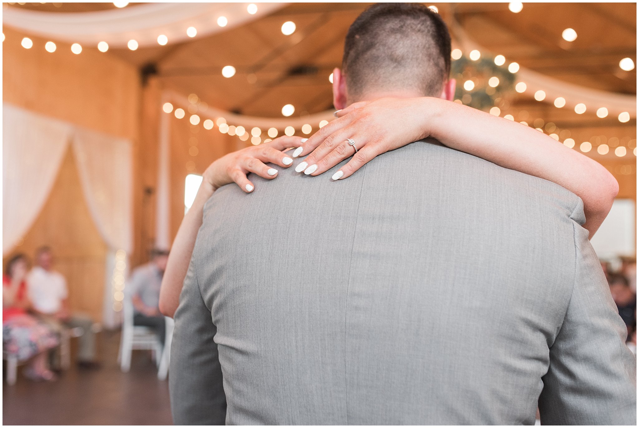 Bride and groom first dance during Oak Hills wedding in the barn | Sage Green and Gray Summer Wedding at Oak Hills | Jessie and Dallin Photography