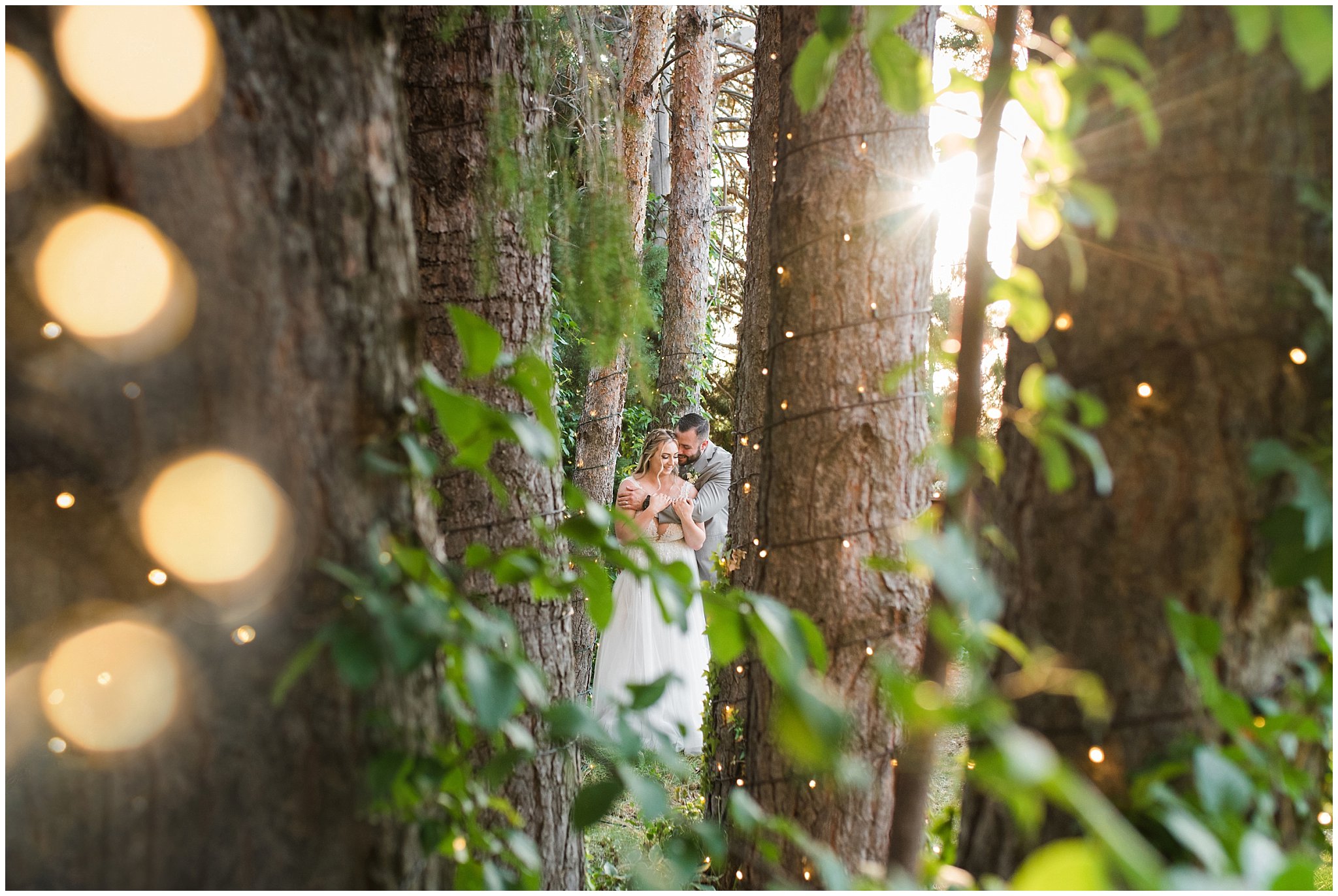 Bride and groom portraits with gray suit and champagne dress and veil and white floral bouquet in pine trees | Sage Green and Gray Summer Wedding at Oak Hills | Jessie and Dallin Photography