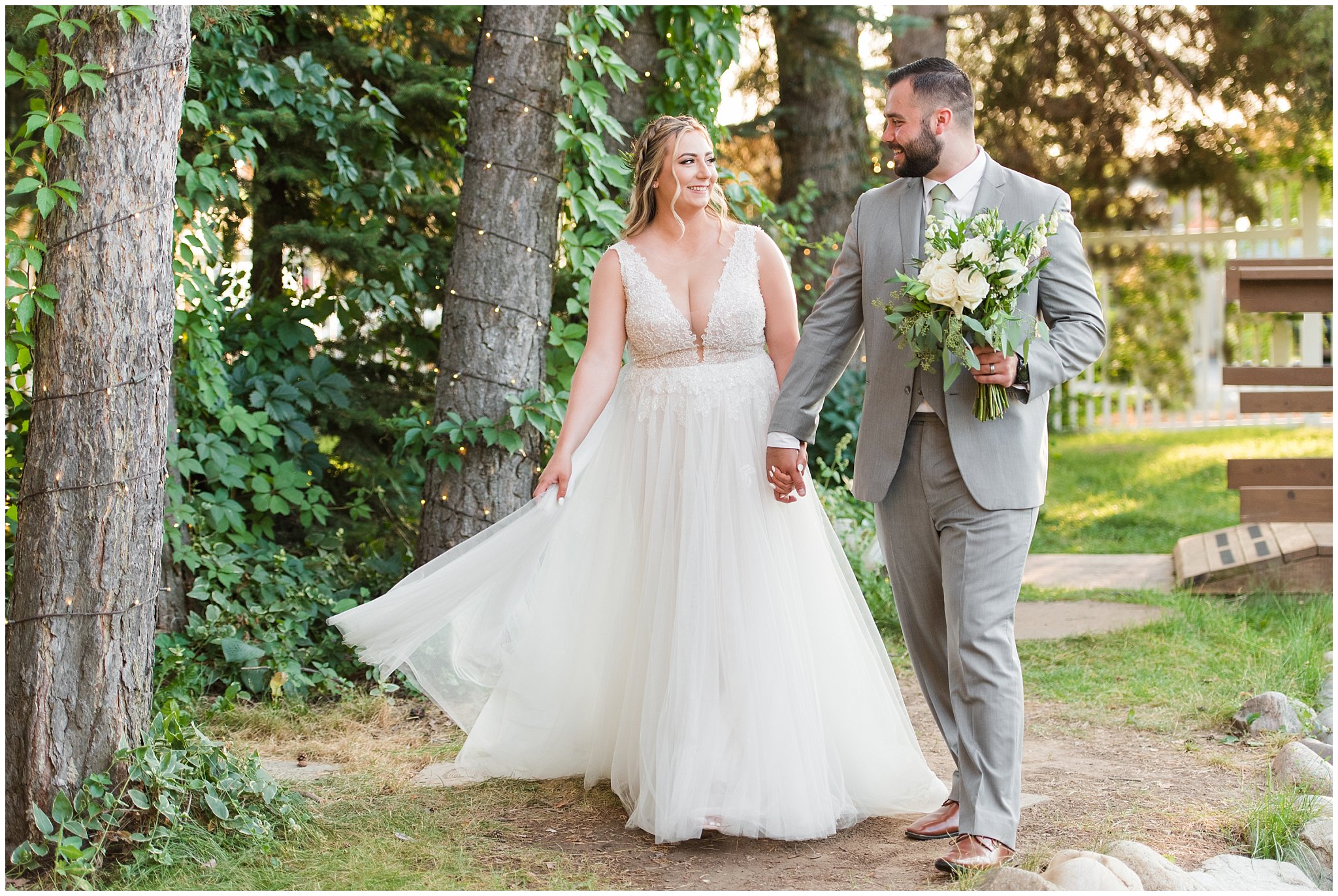 Bride and groom portraits with gray suit and champagne dress and veil and white floral bouquet in pine trees | Sage Green and Gray Summer Wedding at Oak Hills | Jessie and Dallin Photography