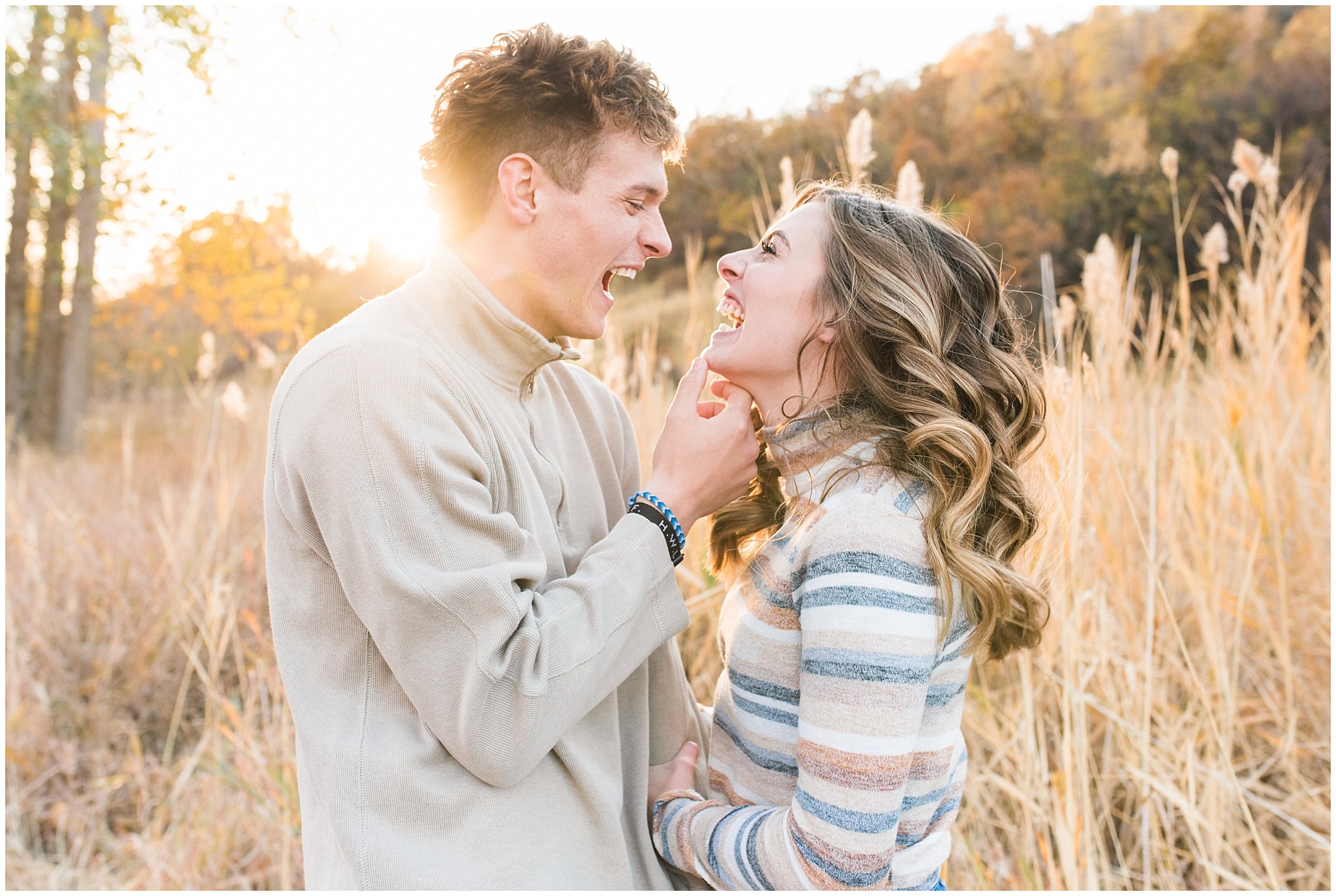 Candid photos of couple in casual cream colored fall sweaters | Utah Fall Engagement Session in a Golden Field | Jessie and Dallin Photography
