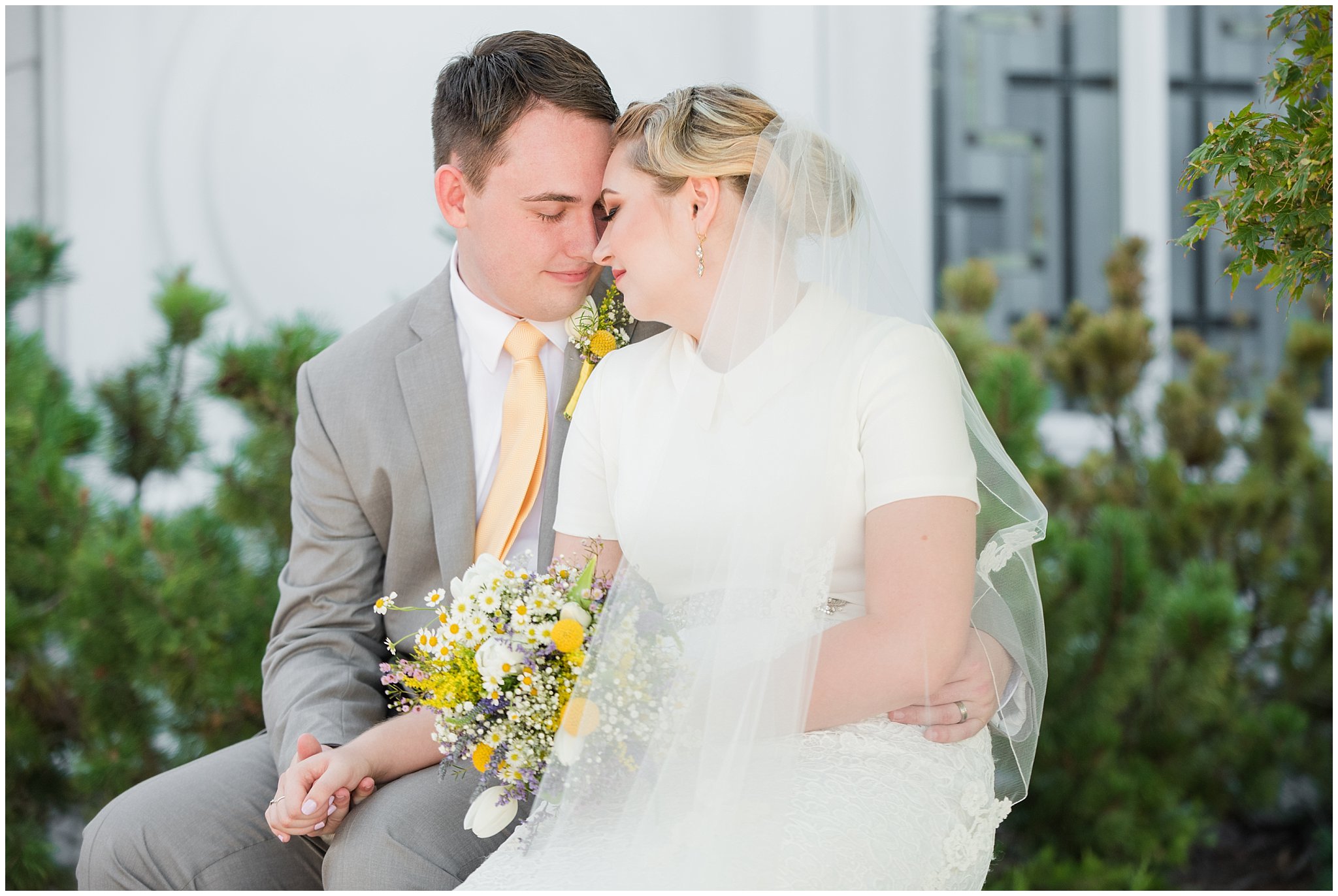 Bride and groom vintage wedding portraits at the Bountiful Temple in the summer with wildflower bouquet | Fountain View Event Venue and Bountiful Temple Wedding | Jessie and Dallin Photography