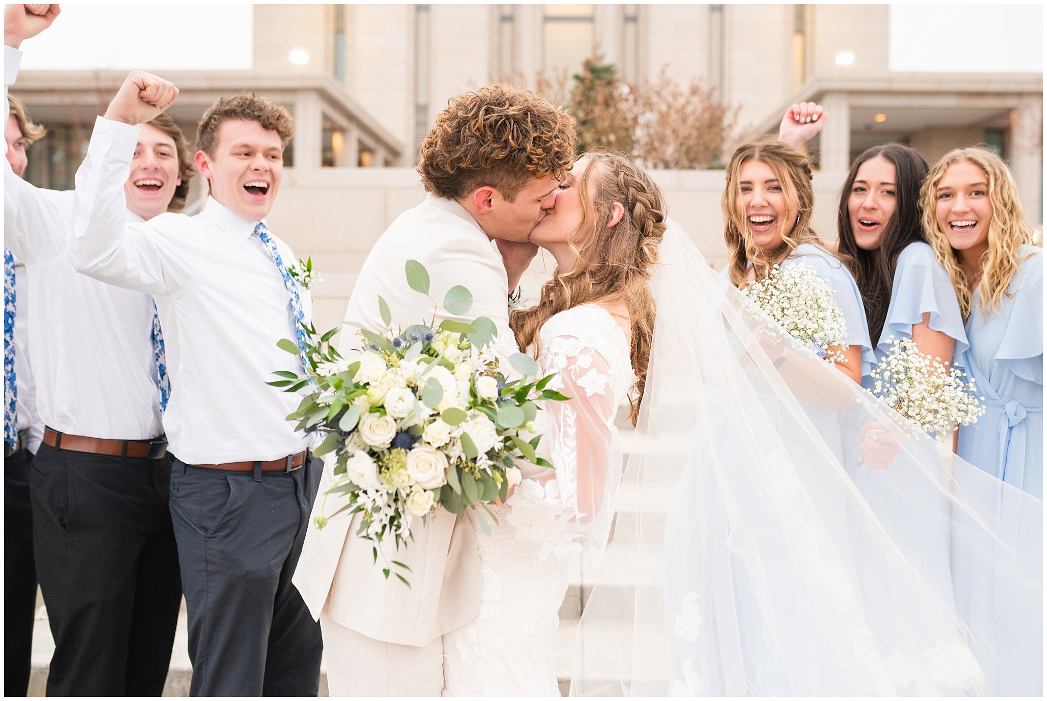 Wedding party with light blue dresses and ties with white bouquets | Oquirrh Mountain Temple and Draper Day Barn Winter Wedding | Jessie and Dallin Photography