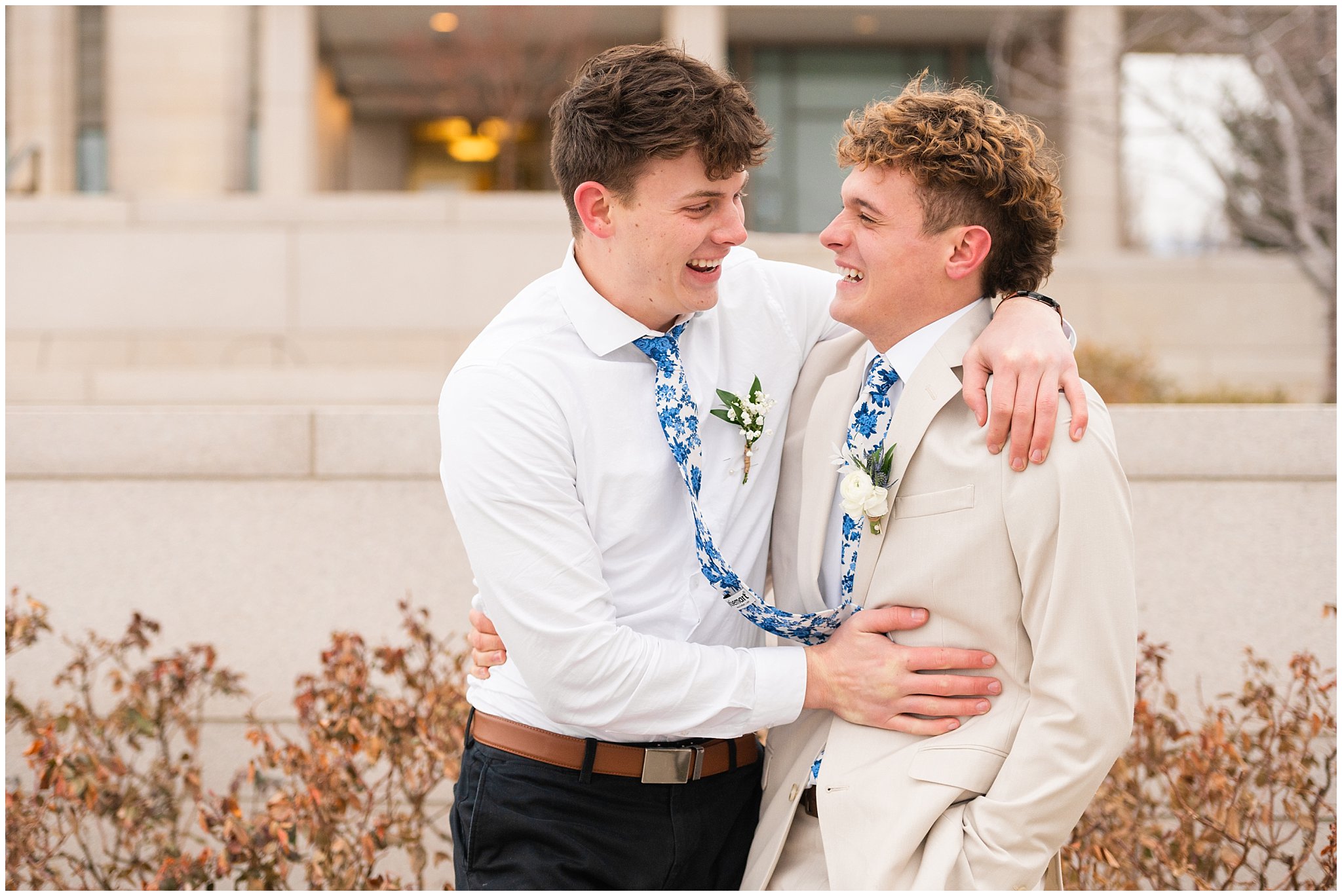 Groom surrounded by groomsmen candid moment | Oquirrh Mountain Temple and Draper Day Barn Winter Wedding | Jessie and Dallin Photography