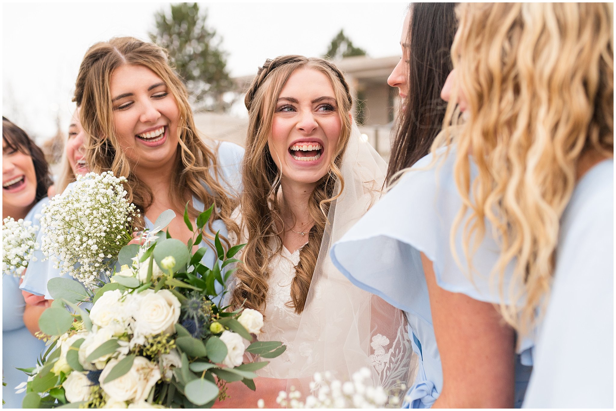 Bride with bridesmaids in light blue dresses with white bouquets | Oquirrh Mountain Temple and Draper Day Barn Winter Wedding | Jessie and Dallin Photography
