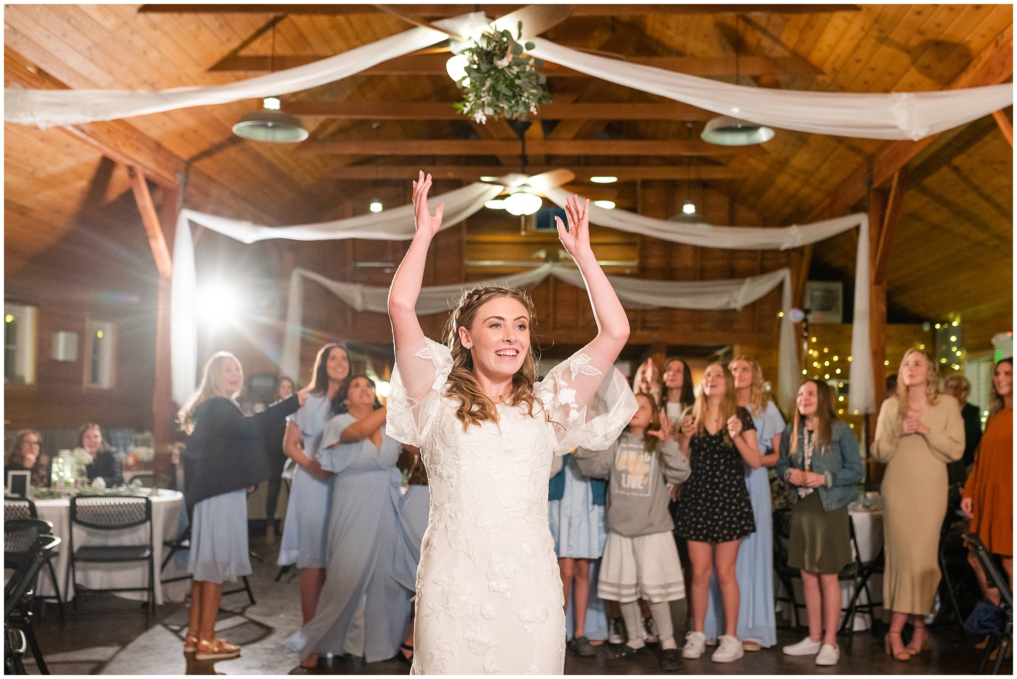 Bouquet toss at barn wedding | Oquirrh Mountain Temple and Draper Day Barn Winter Wedding | Jessie and Dallin Photography