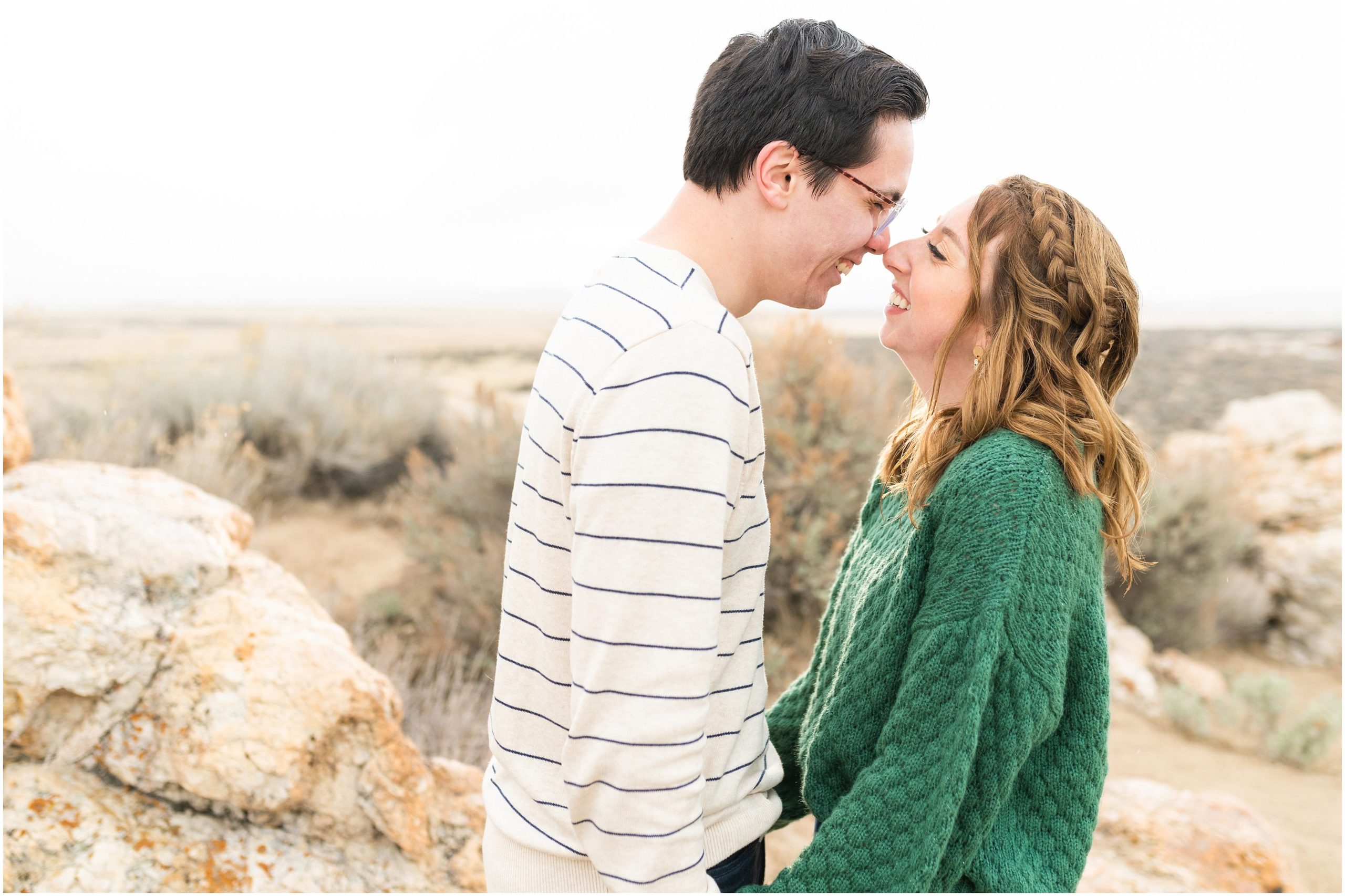 Couple laughing during Antelope Island Stormy Engagement Session | Jessie and Dallin Photography