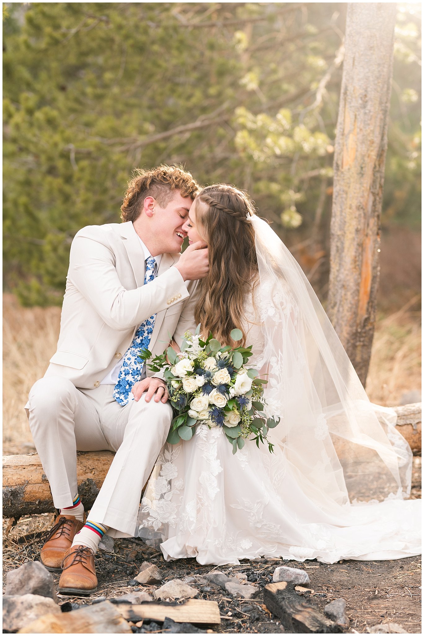 Bride and groom in the mountains wearing lace dress with veil and white floral bouquet and creme colored suit with blue tie | Tibble Fork Winter Formal Session | Jessie and Dallin Photography