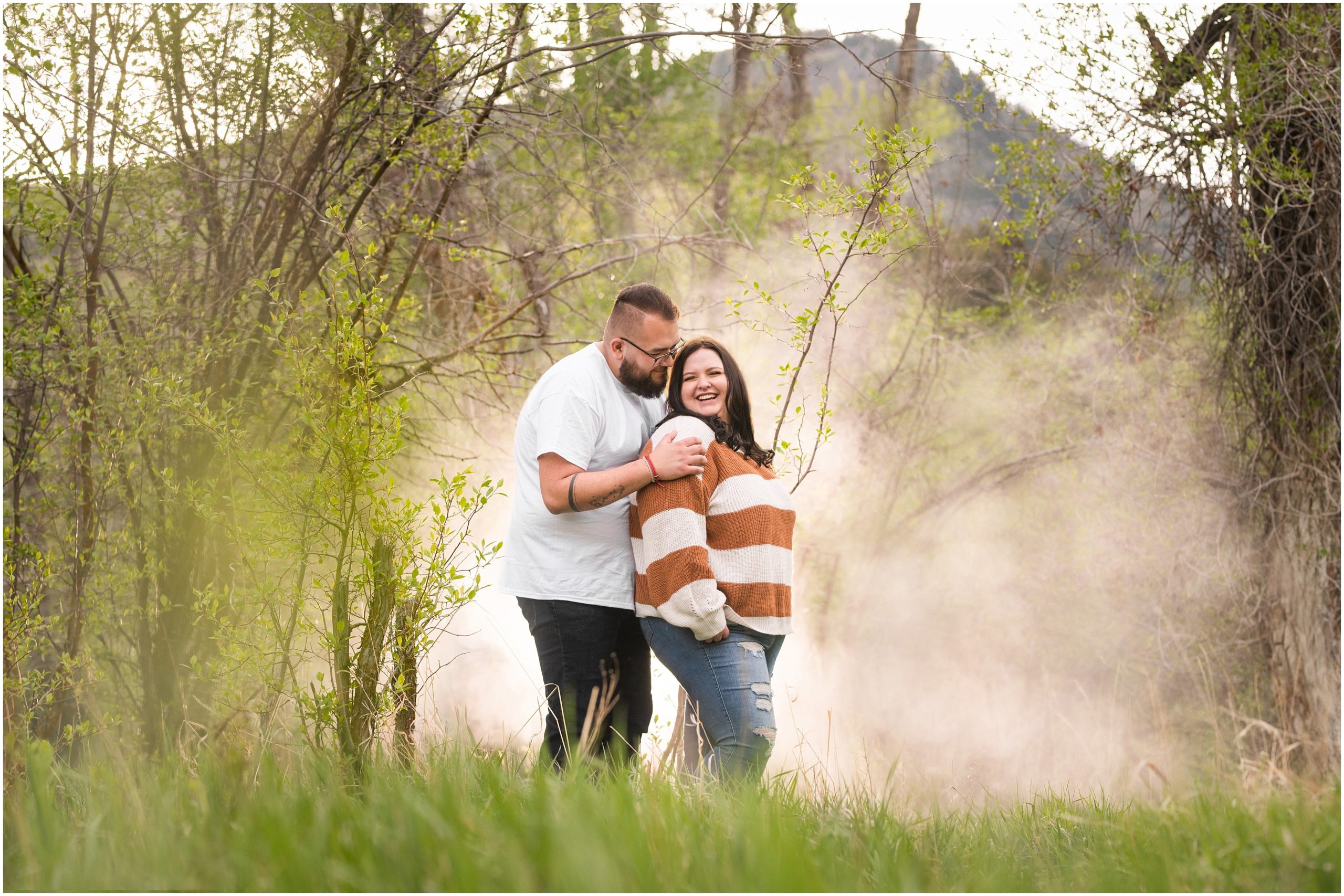 Couple in the woods and trees in causal outfit for Ogden Valley Summer Engagement Session