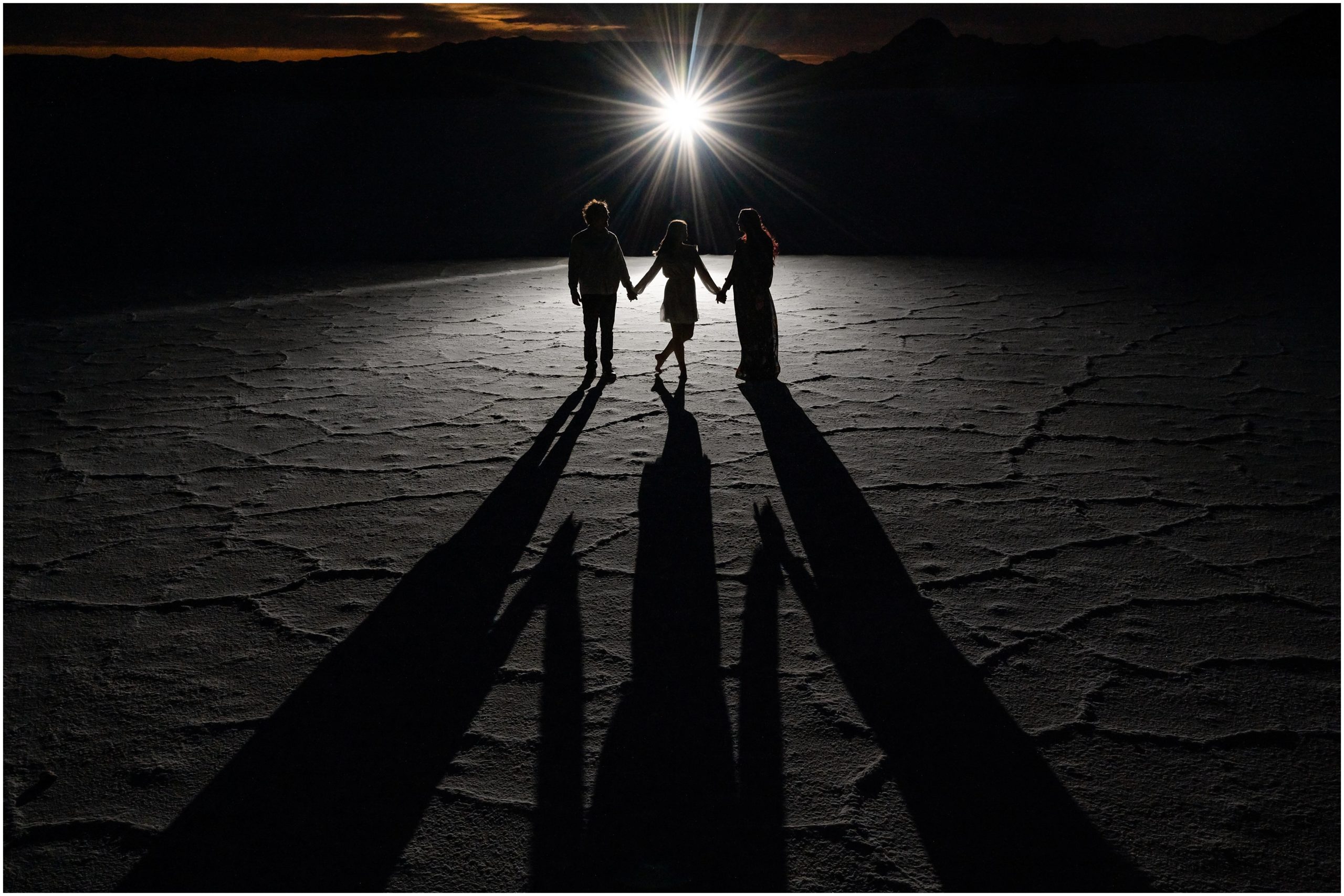 Couple with the moon and night sky at their Bonneville Salt Flats Sunset Engagement | Jessie and Dallin Photography