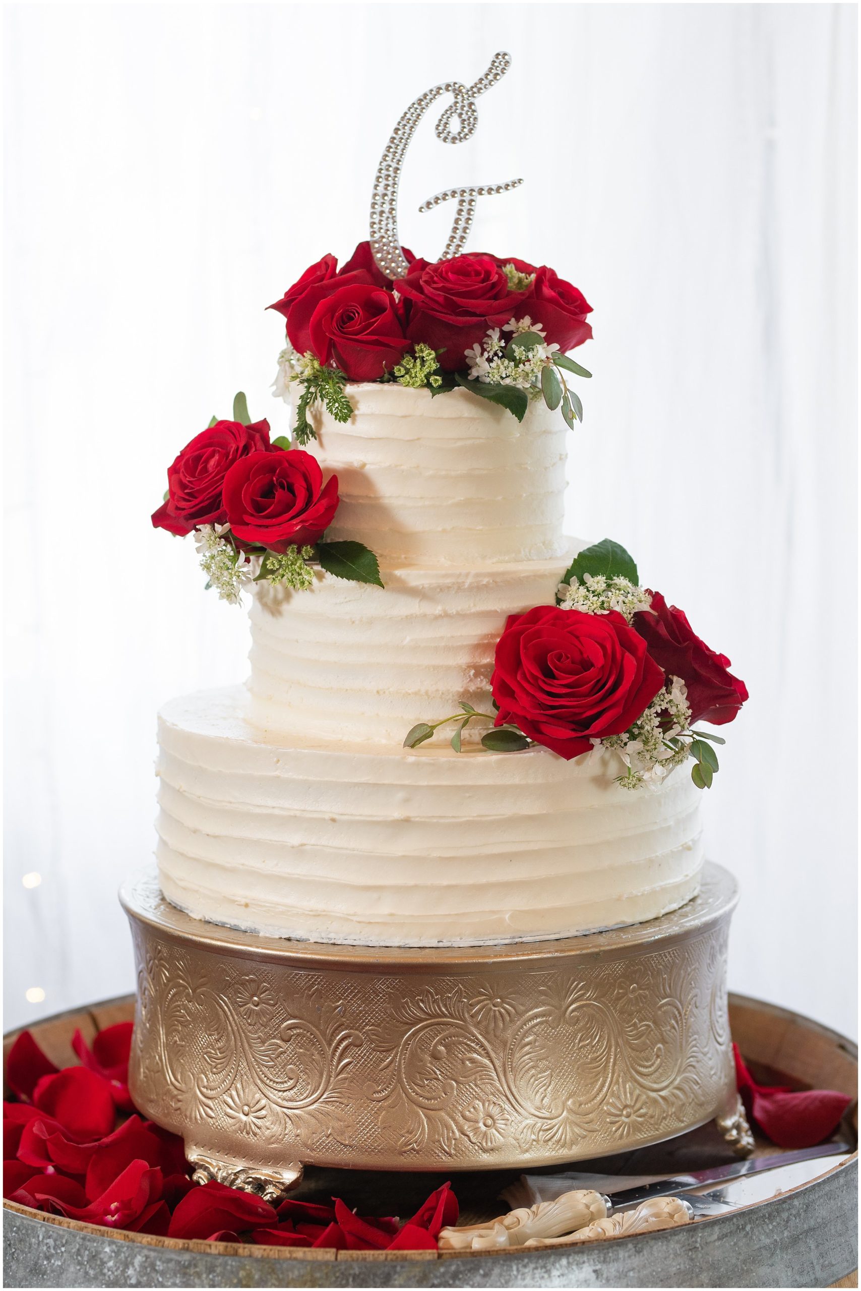 White frosted cake with three tiers and red roses | Red and Black Oak Hills Utah Spring Wedding | Jessie and Dallin Photography
