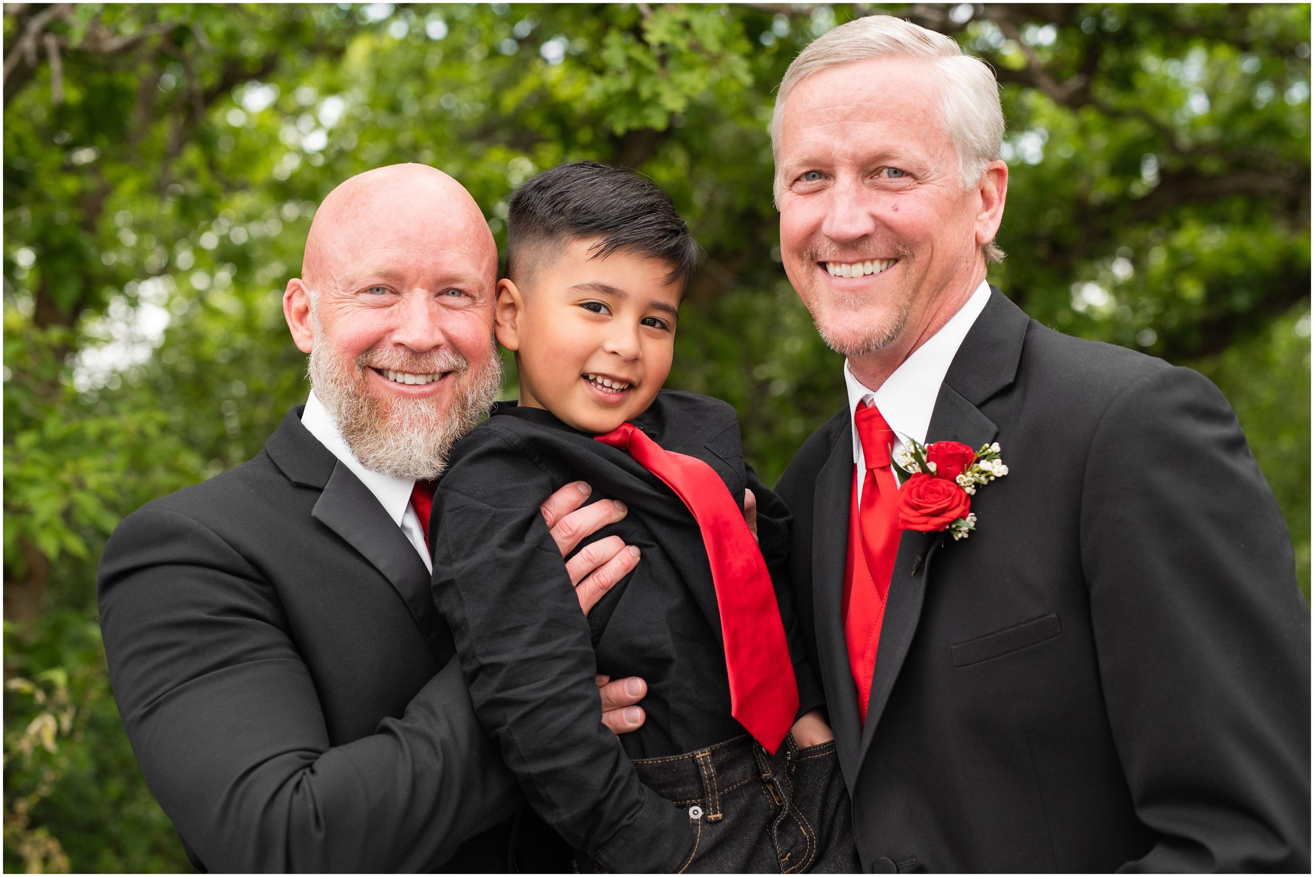Groom and groomsmen photos with red tie and black suits and University of Utah socks | Red and Black Oak Hills Utah Spring Wedding | Jessie and Dallin Photography