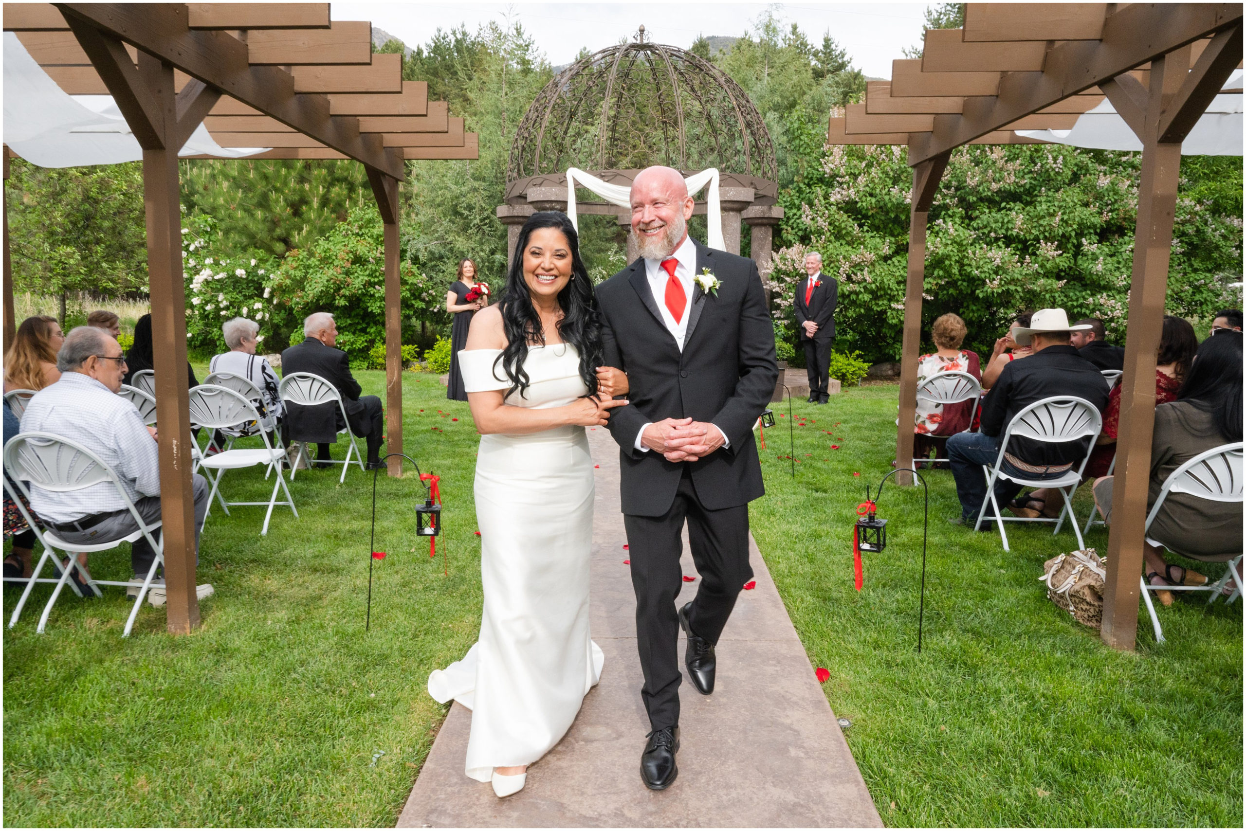 Wedding ceremony with red roses in aisle | Red and Black Oak Hills Utah Spring Wedding | Jessie and Dallin Photography