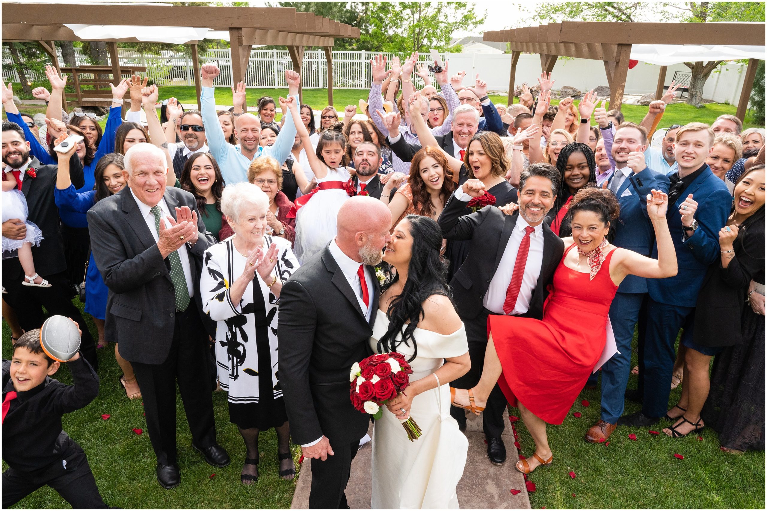 Full family photo in the middle of the aisle after ceremony | Red and Black Oak Hills Utah Spring Wedding | Jessie and Dallin Photography