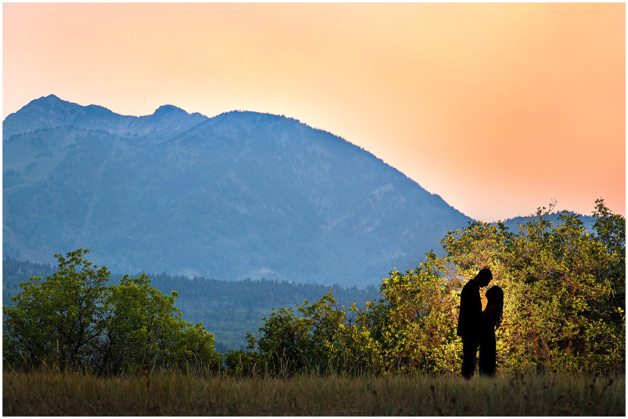 Couple silhouetted on the mountains| Summer Utah Mountain Engagement | Jessie and Dallin Photography