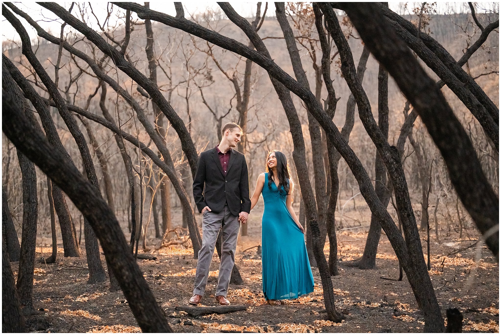 Couple standing in the middle of a burned forest | Summer Utah Mountain Engagement | Jessie and Dallin Photography
