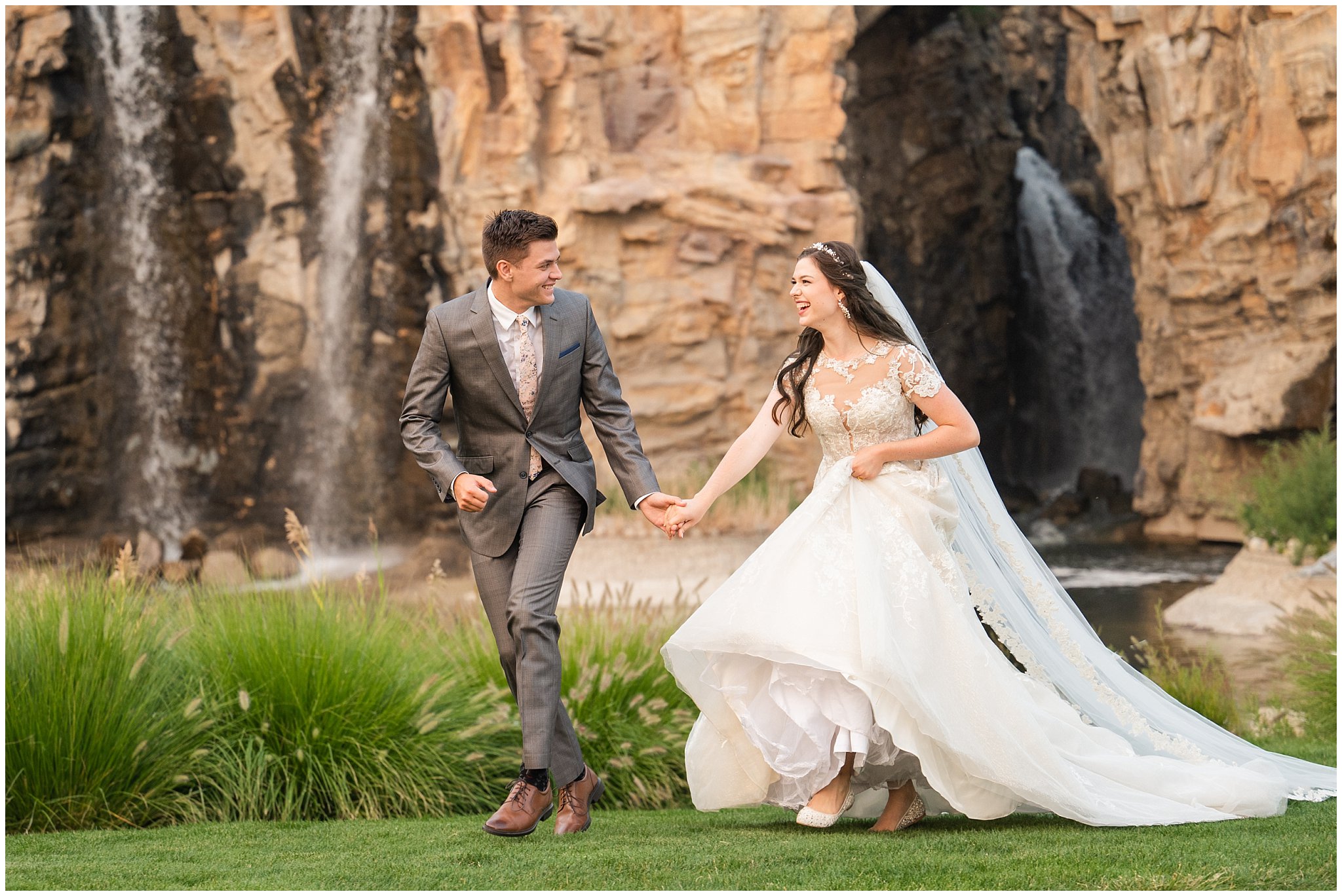 Bride and Groom in front of waterfalls during wedding portraits during the summer surrounded by flowers and gardens | Thanksgiving Point Ashton Garden Formal Session | Jessie and Dallin Photography