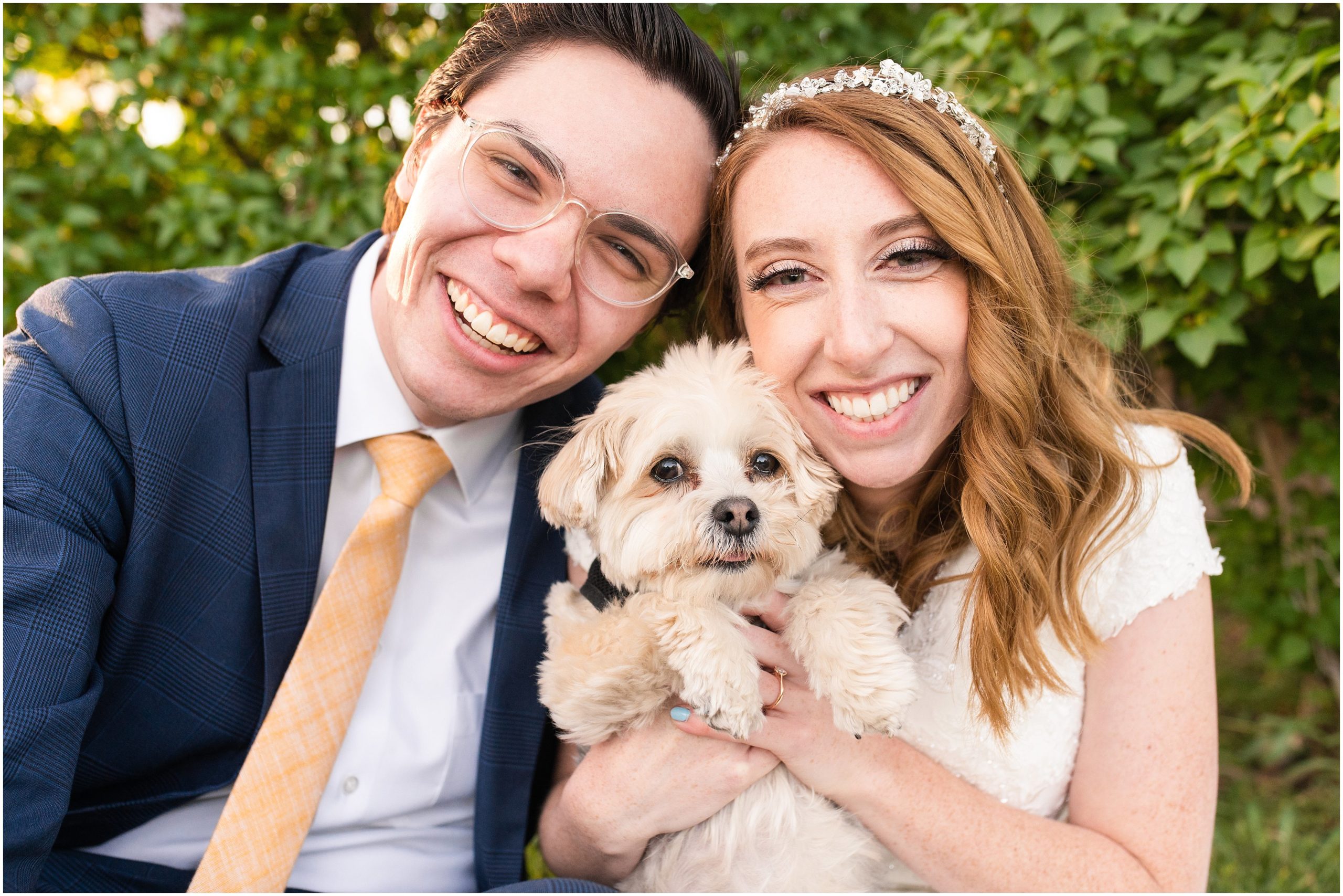 Bride and Groom wearing Converse shoes, navy suit with yellow tie, and sunflower bouquet with puppy in Salt Lake City | International Peace Gardens Formal Session | Jessie and Dallin Photography