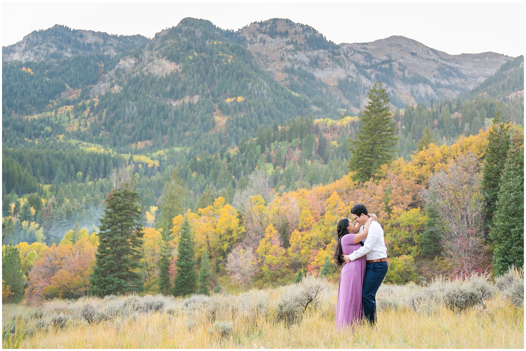 Couple dressed in dress and shirt and tie in the Utah mountains with fall leaves | Tibble Fork Fall Engagement Session | Jessie and Dallin Photography