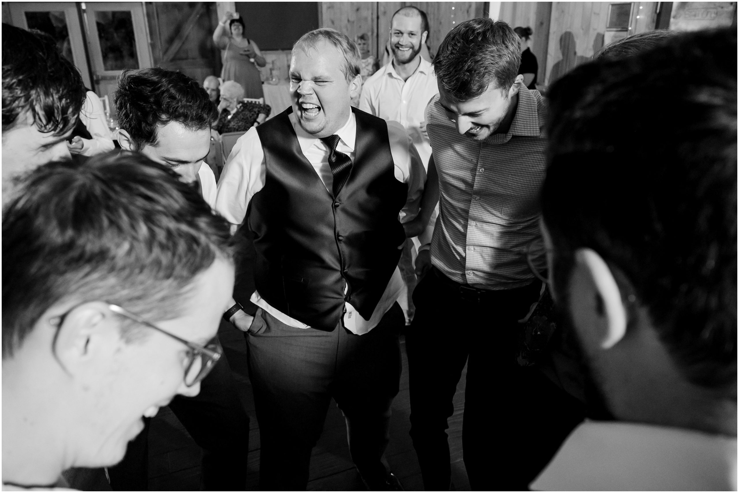 Dance party with guests in a barn | Orchid Inspired Summer Wedding at Oak Hills Utah | Jessie and Dallin Photography