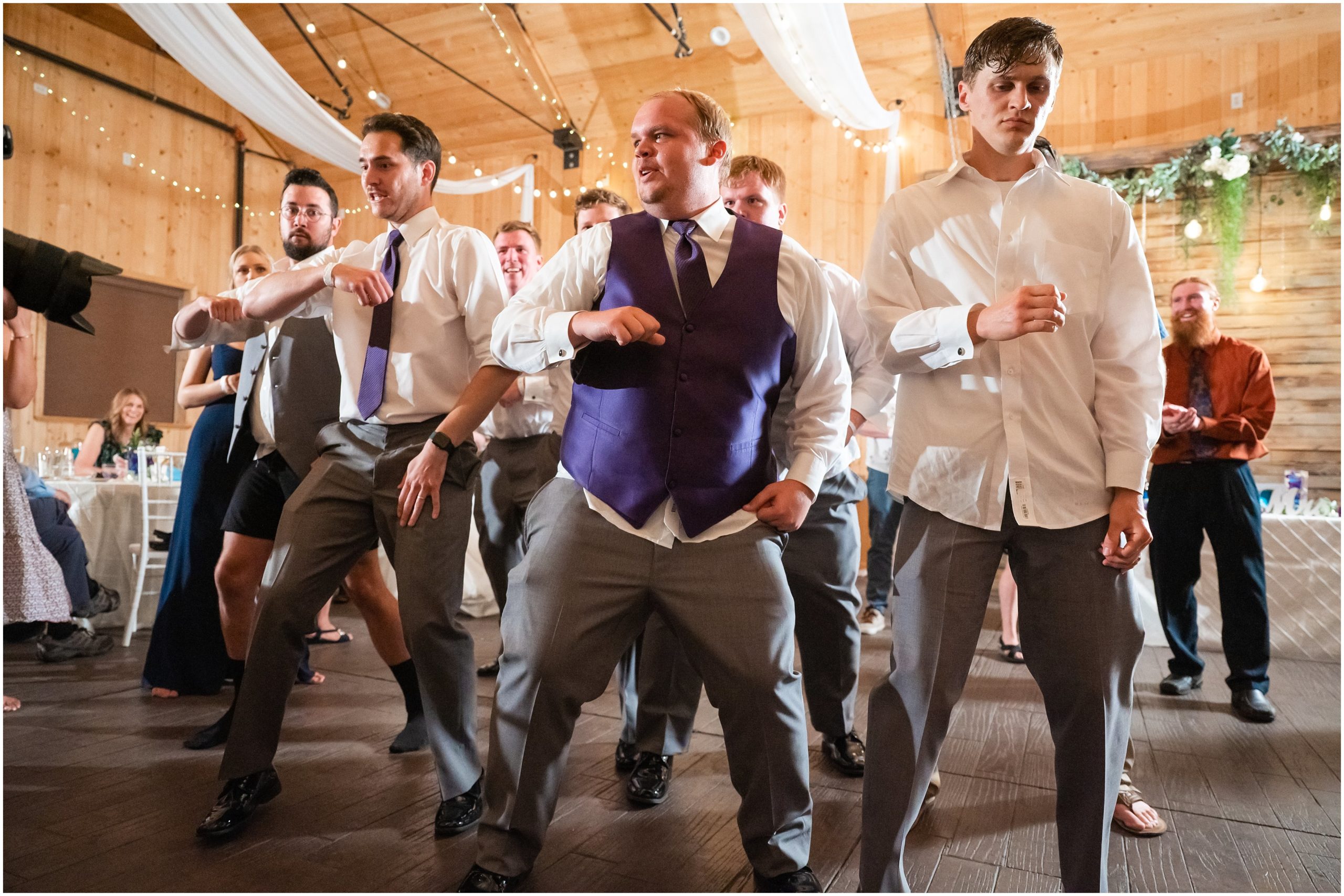 Dance party with guests in a barn | Orchid Inspired Summer Wedding at Oak Hills Utah | Jessie and Dallin Photography