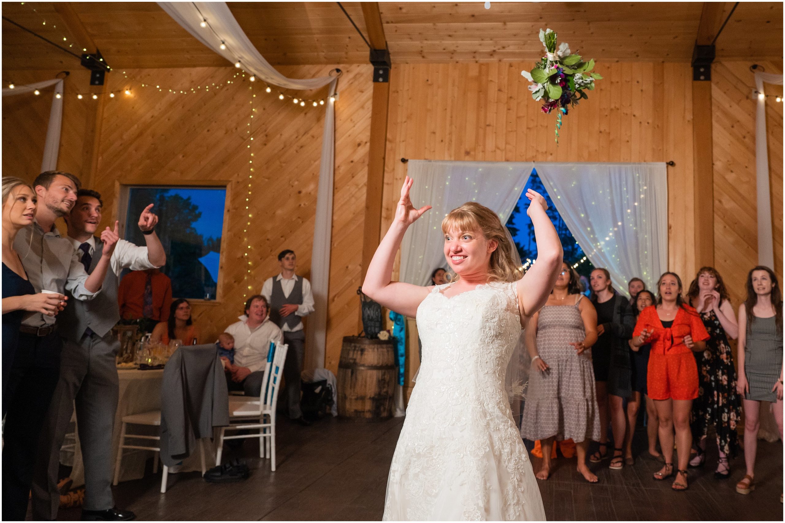 Bouquet toss in a barn | Orchid Inspired Summer Wedding at Oak Hills Utah | Jessie and Dallin Photography