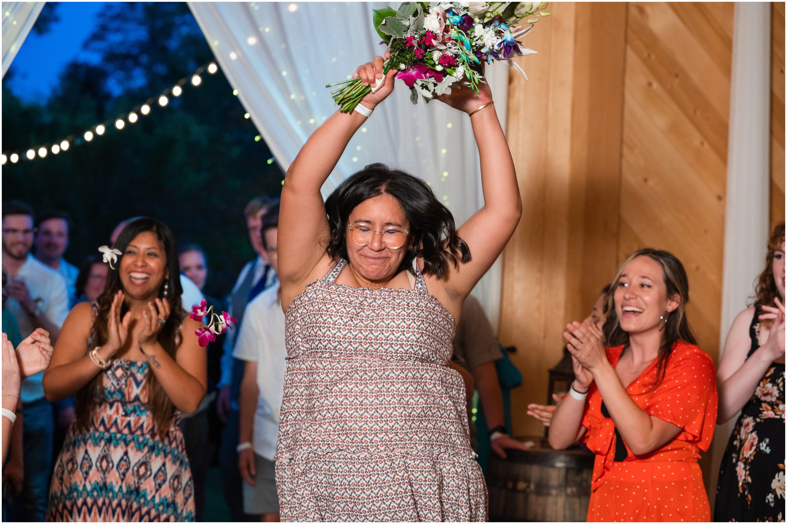 Bouquet toss in a barn | Orchid Inspired Summer Wedding at Oak Hills Utah | Jessie and Dallin Photography