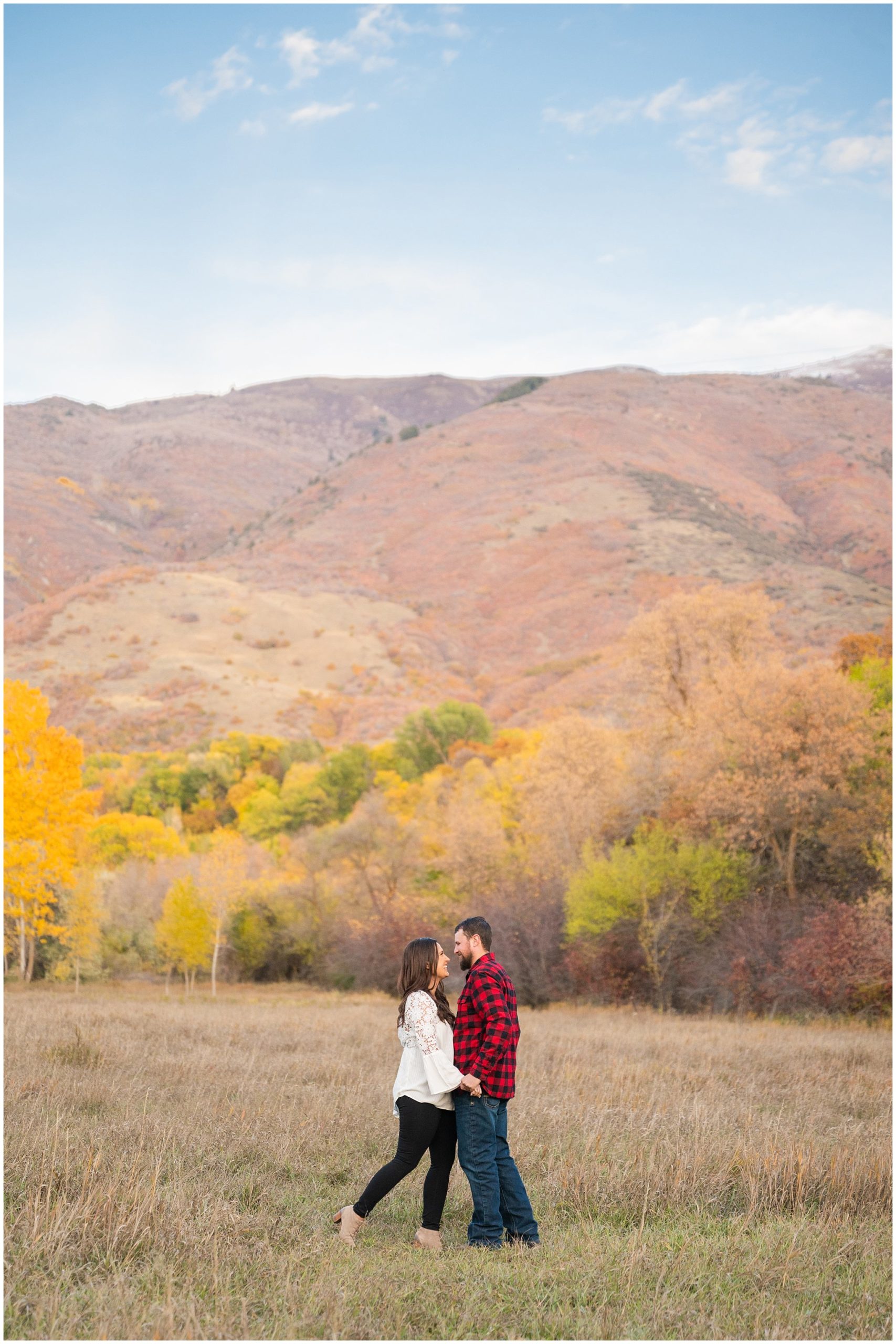 Couple in plaid and fall sweaters in a tree filled meadow | Utah Meadow Fall Engagement | Jessie and Dallin Photography