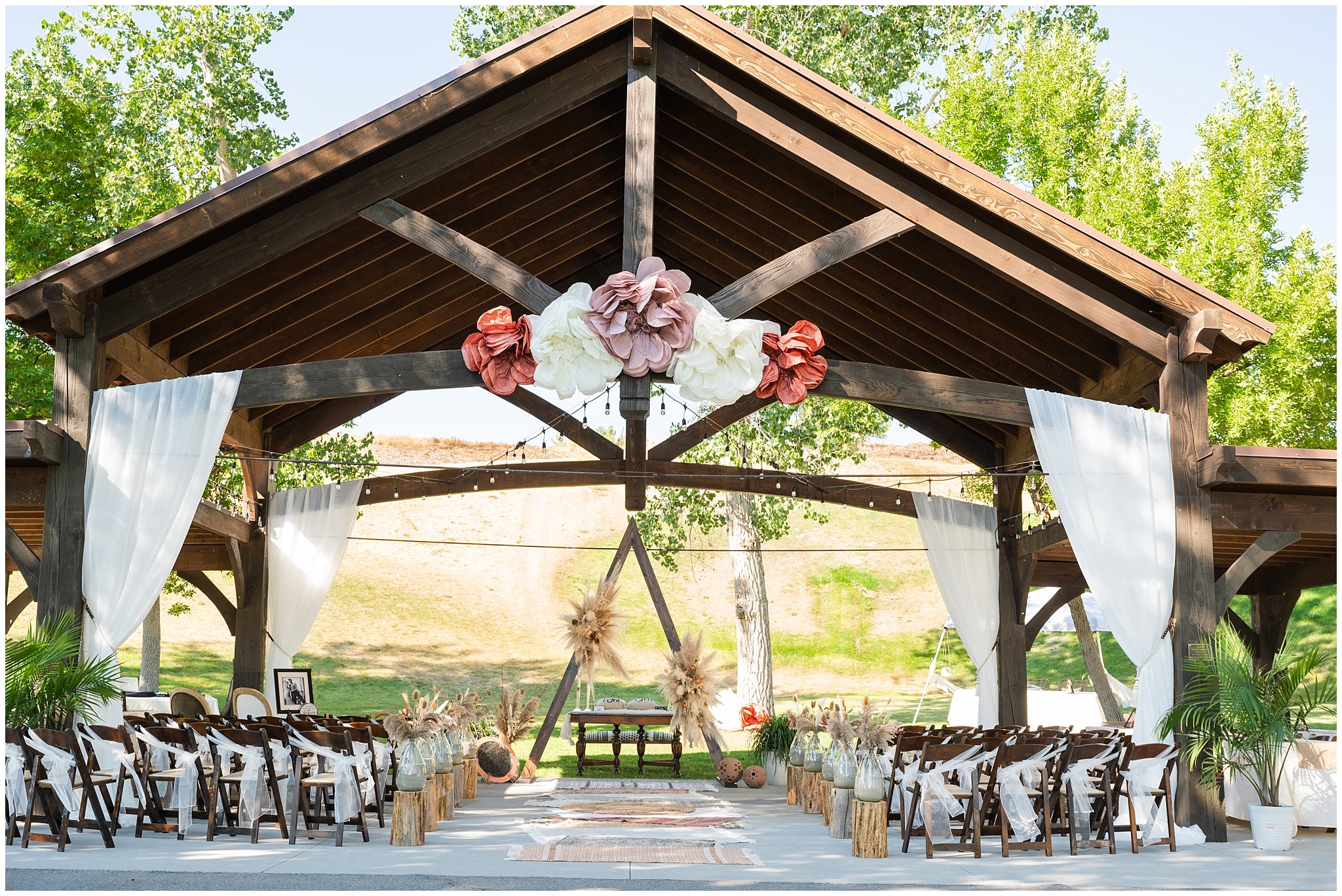 Pavilion setup and boho decor at Lions Park in Cache Valley | Logan Utah Outdoor Summer Wedding | Jessie and Dallin Photography