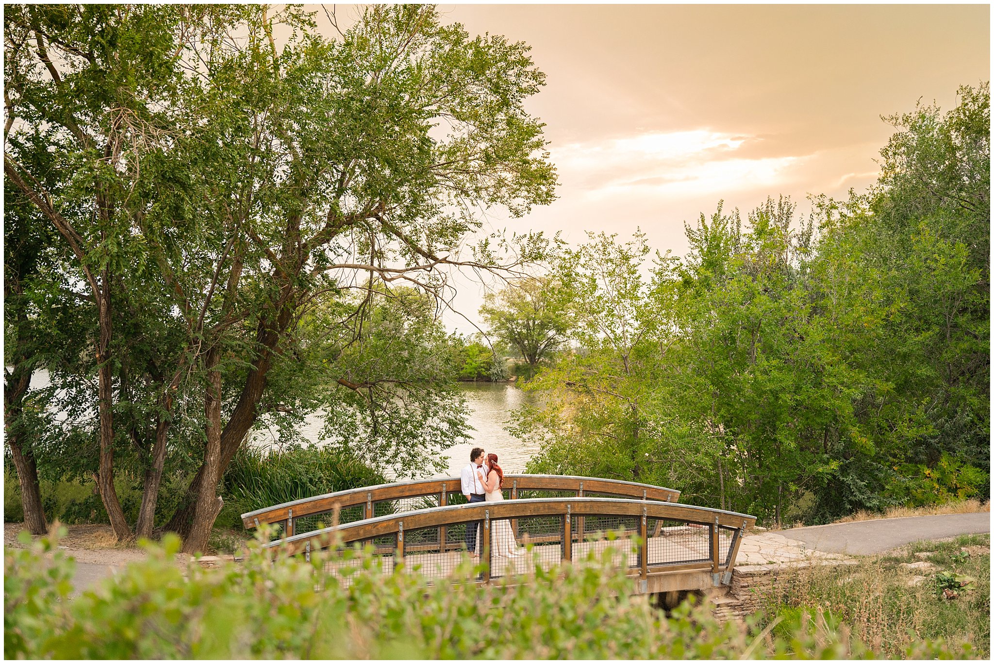 Bride and groom portraits in boho lace dress and suspenders and bowtie at the Kaysville Ponds | Logan Utah Outdoor Summer Wedding | Jessie and Dallin Photography
