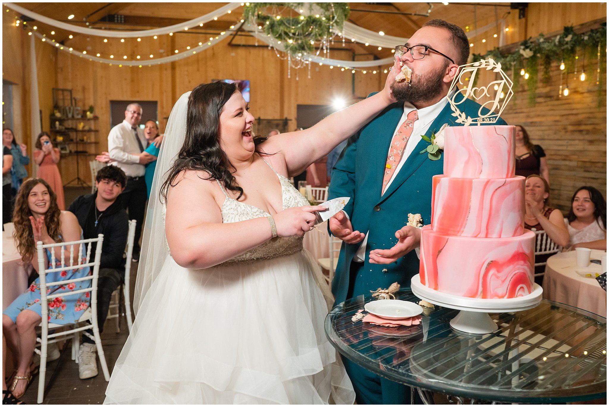 Cutting and smashing salmon pink marbled wedding cake | Green and Salmon Pink Utah Wedding | Oak Hills | Jessie and Dallin Photography