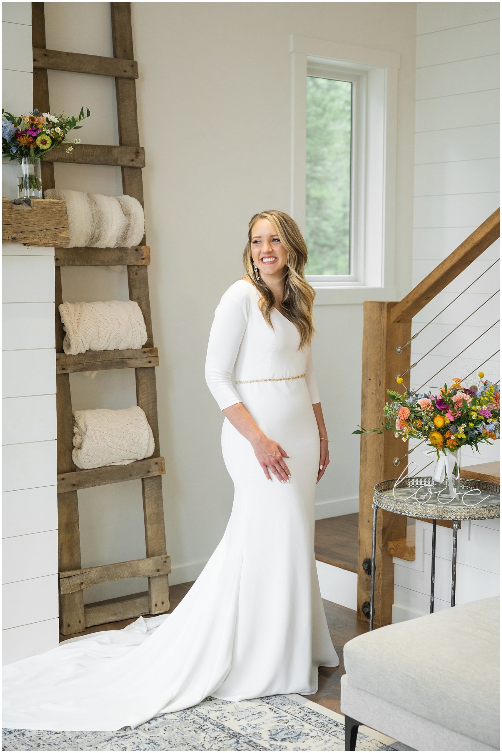 Bride in elegant fitted dress getting ready inside modern cabin | Mountainside Weddings Kalispell Montana Destination Wedding | Jessie and Dallin Photography