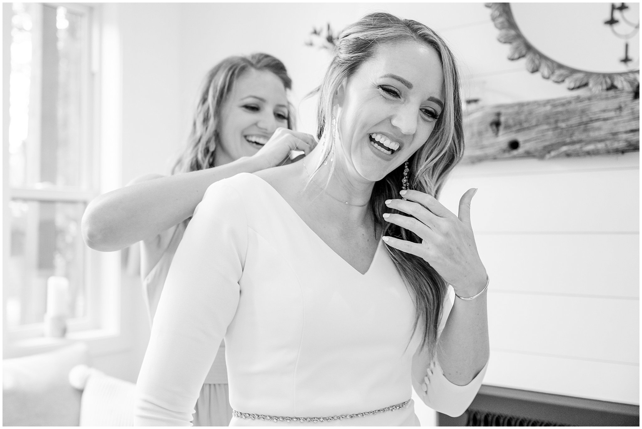 Bride with bridesmaids getting ready inside modern cabin in coral pink dresses | Mountainside Weddings Kalispell Montana Destination Wedding | Jessie and Dallin Photography