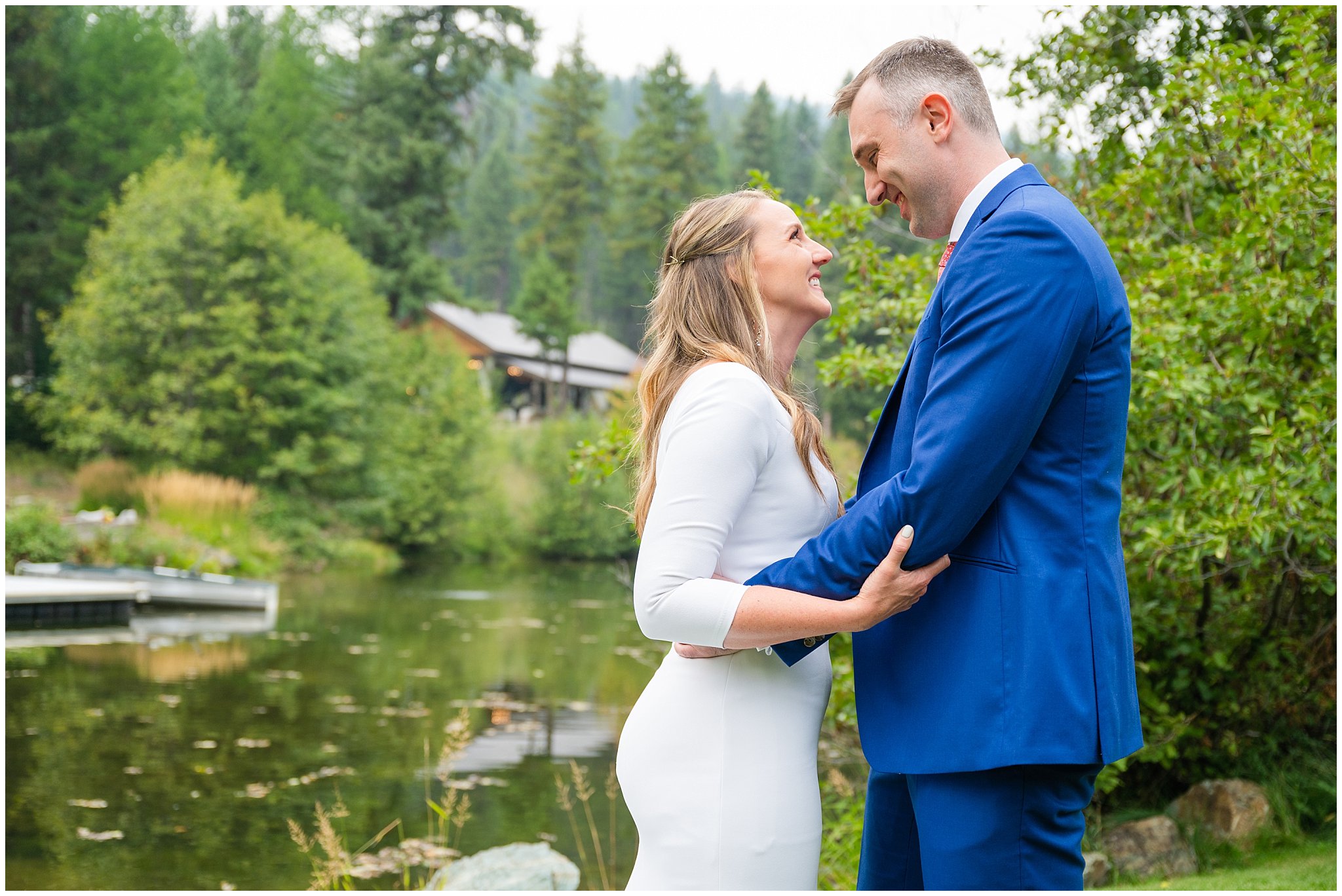 Bride and groom in exchange gifts and have first look in the forest of Montana by a pond | Mountainside Weddings Kalispell Montana Destination Wedding | Jessie and Dallin Photography