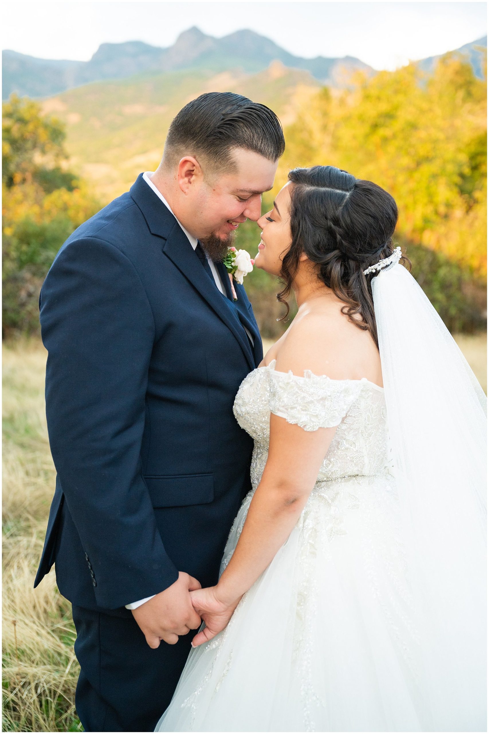 Bride and groom portraits in front of the Utah mountains with bride wearing long princess dress and long veil | Rustic Mountain Destination Wedding at Oak Hills Utah | Jessie and Dallin Photography