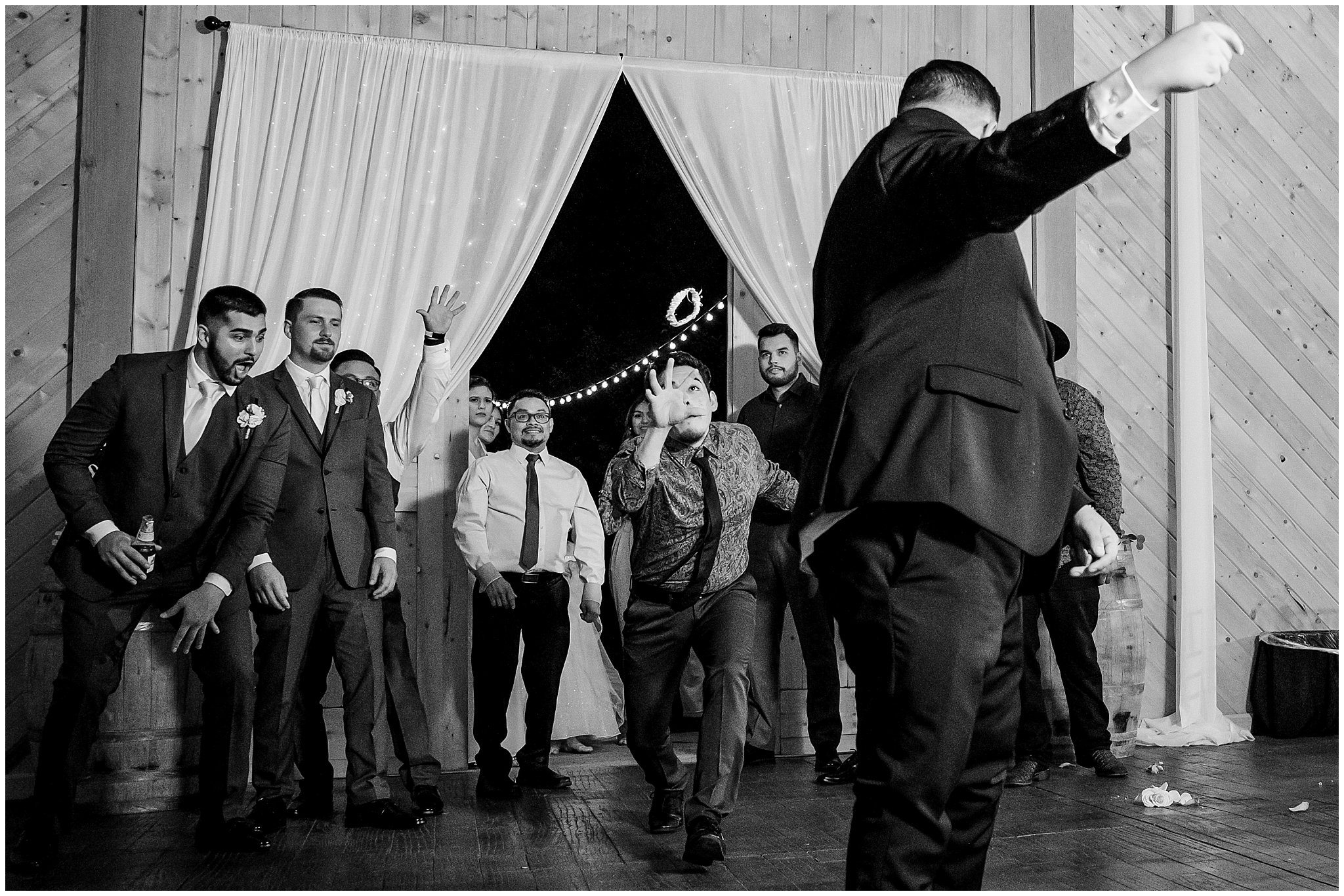 Garter toss during rustic barn reception | Rustic Mountain Destination Wedding at Oak Hills Utah | Jessie and Dallin Photography