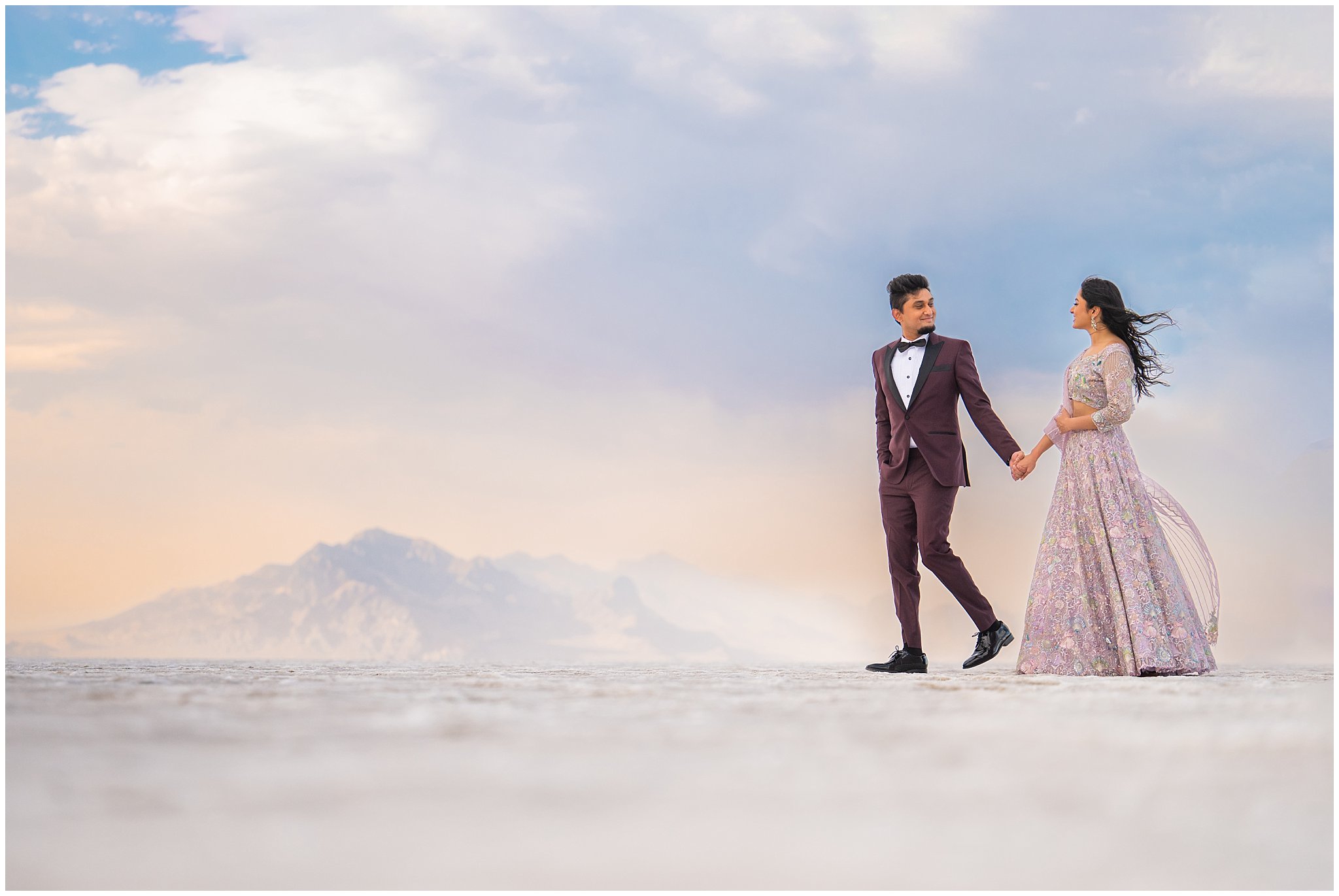 Couple walking during Indian wedding session at the Bonneville Salt Flats