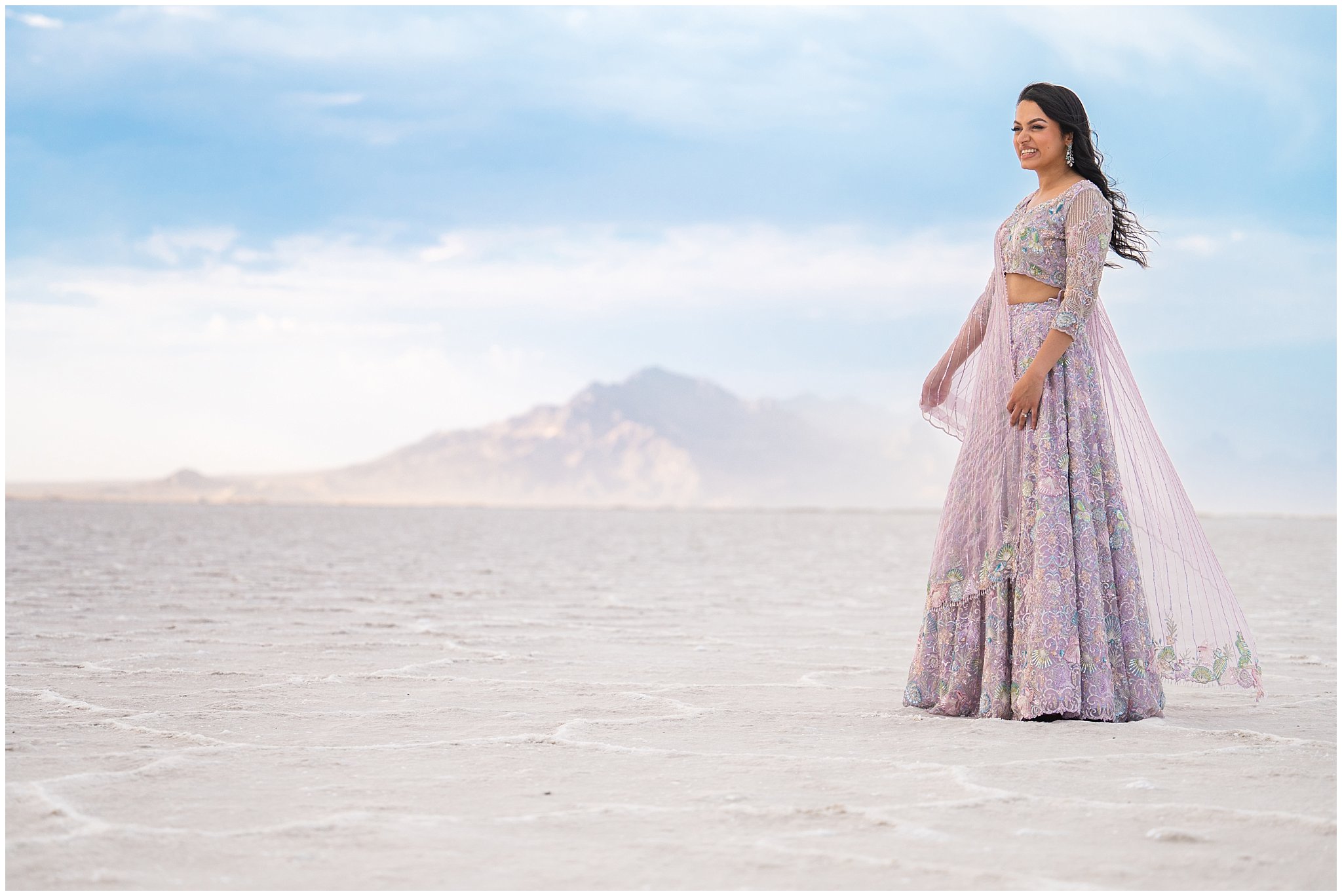 Bride in pink mermaid lehenga during their Indian wedding session at the Bonneville Salt Flats
