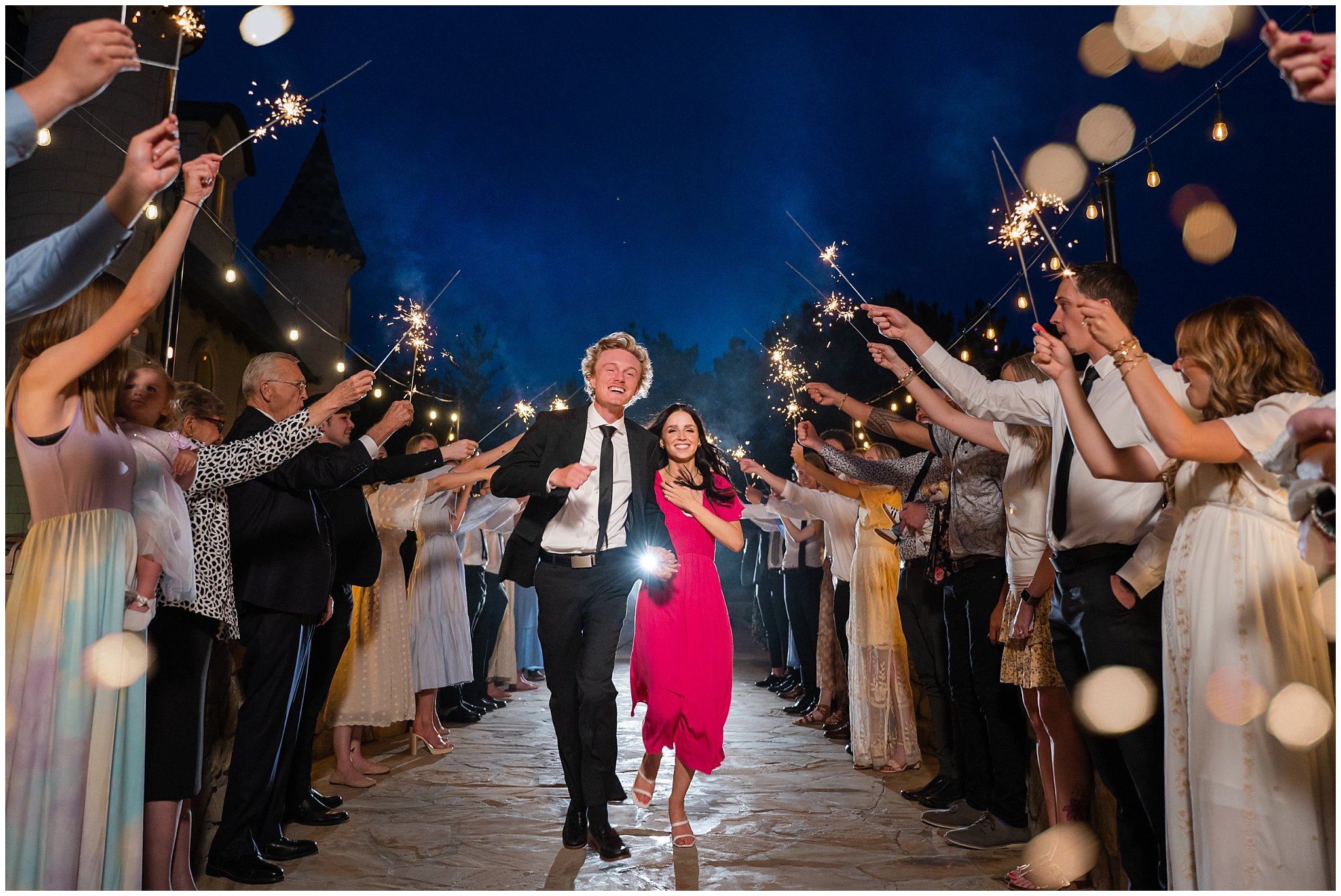 Sparkler grand exit outside of wedding venue | Draper Temple and Wadley Farms Summer Castle Wedding | Jessie and Dallin Photography
