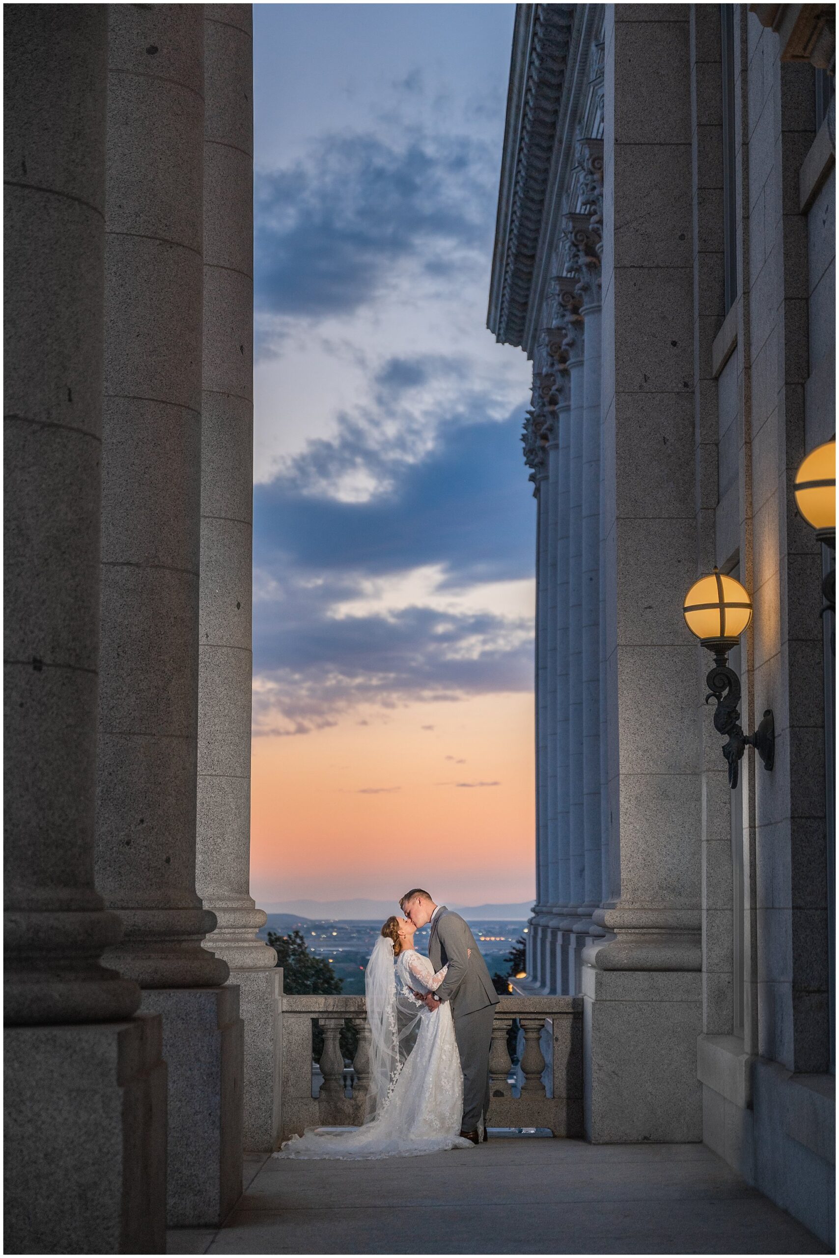 Bride and groom with long cathedral length veil sharing a romantic moment at sunset | Sunset Utah State Capitol Wedding Formal Session | Jessie and Dallin Photography