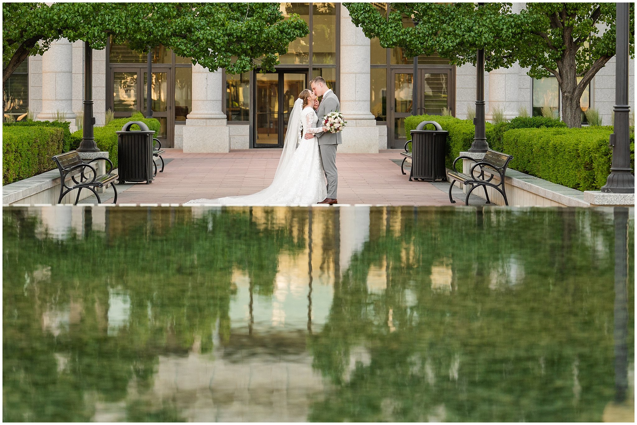 Bride and groom with long cathedral length veil sharing moments and laughter | Sunset Utah State Capitol Wedding Formal Session | Jessie and Dallin Photography