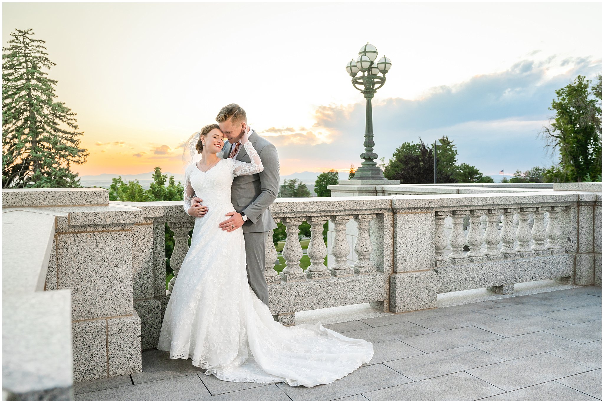 Bride and groom with long cathedral length veil sharing a romantic moment at sunset | Sunset Utah State Capitol Wedding Formal Session | Jessie and Dallin Photography