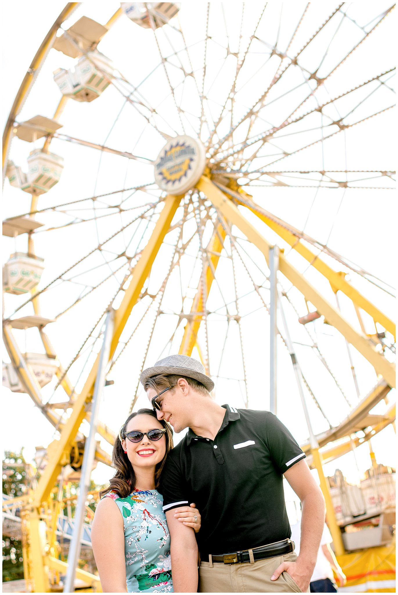 Couple by the Ferris Wheel at the State Fair for their engagement session in Utah | Jessie and Dallin Photography | Utah Wedding Photographers