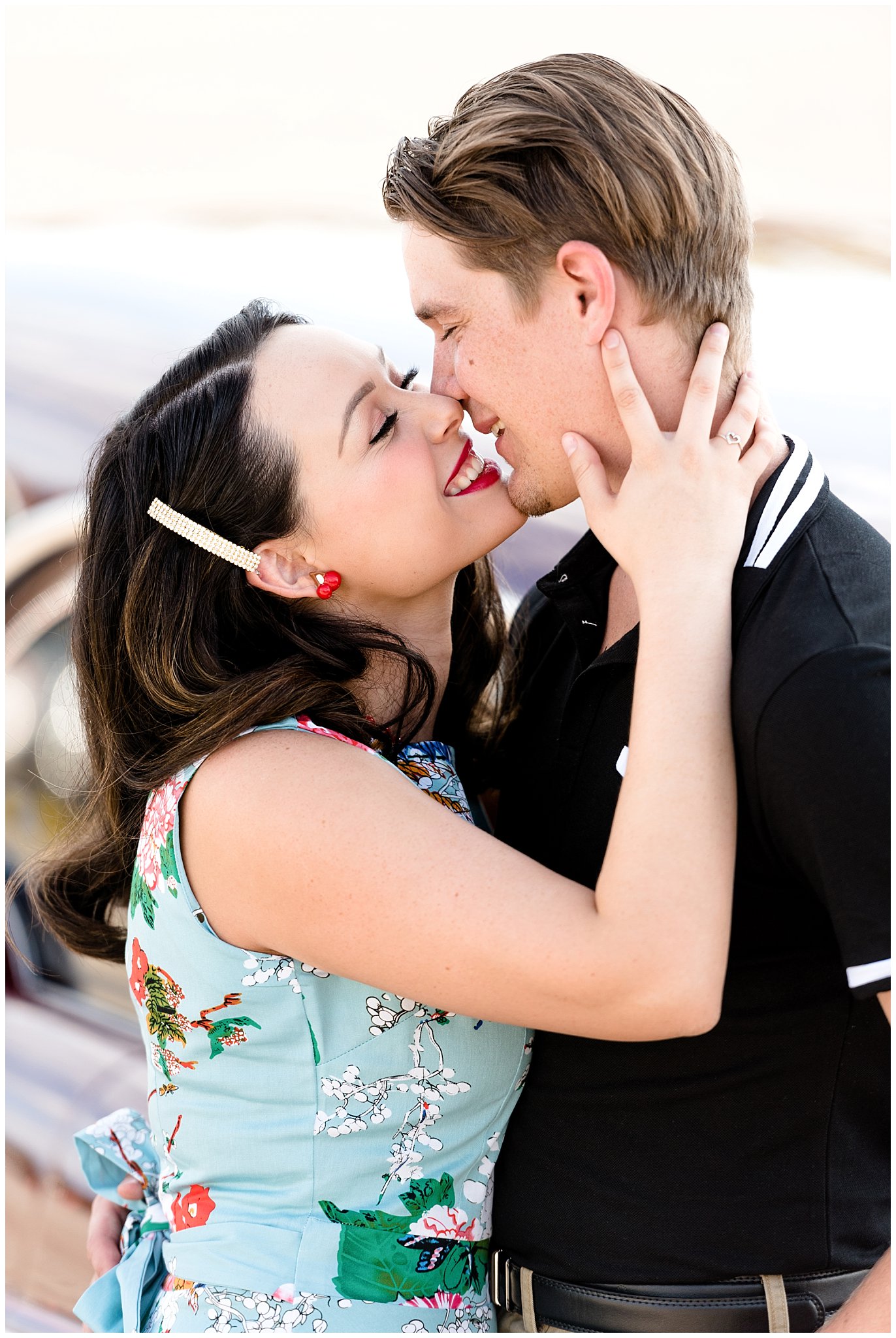 Couple kissing in front of their classic car during their engagement session in Utah | Jessie and Dallin Photography | Utah Wedding Photographers